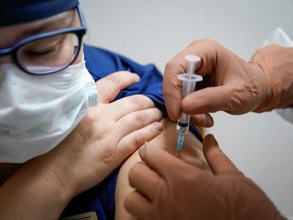 A doctor at the regional hospital receives the vaccine 