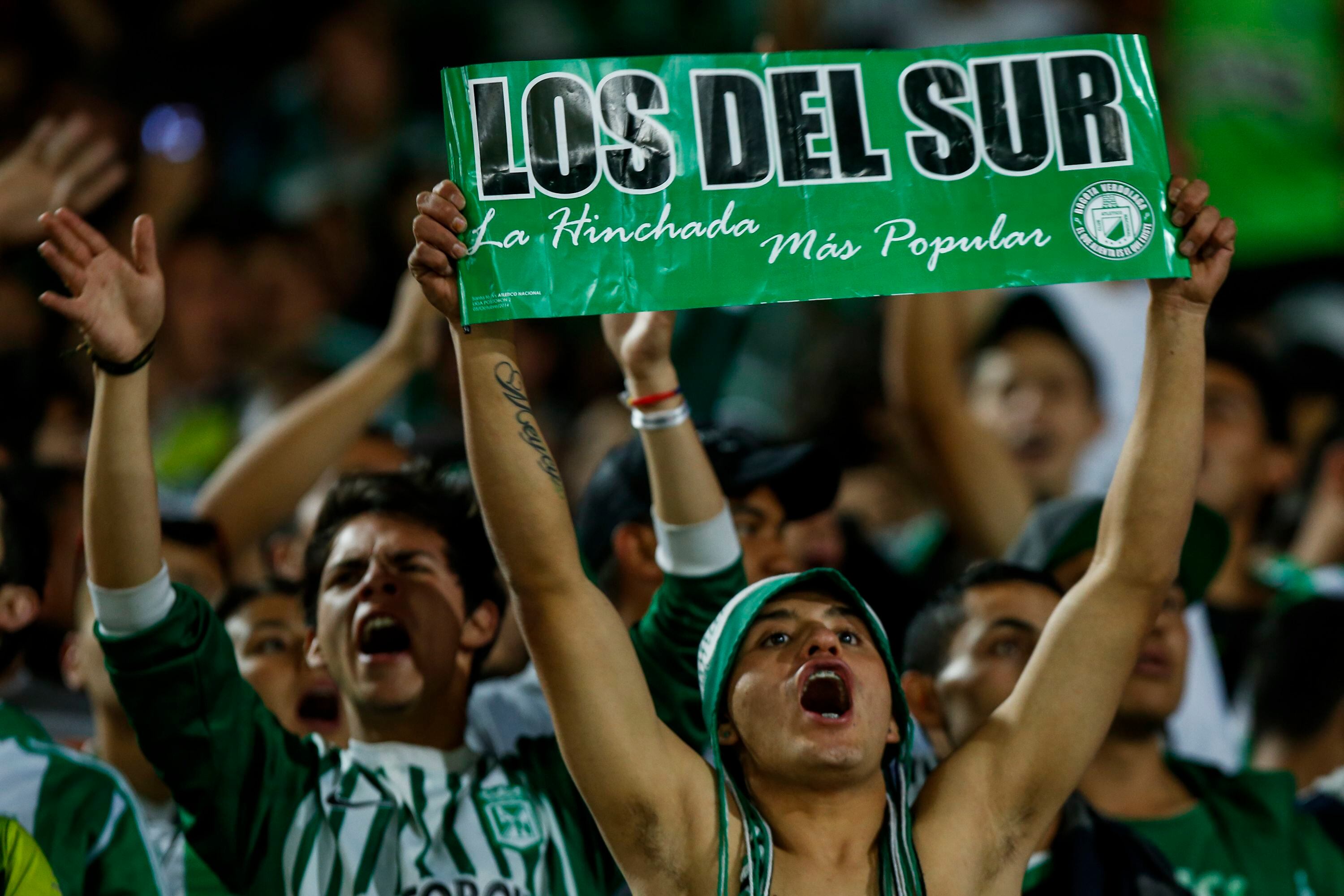 Fans of Atletico Nacional celebrate at the end of a second leg