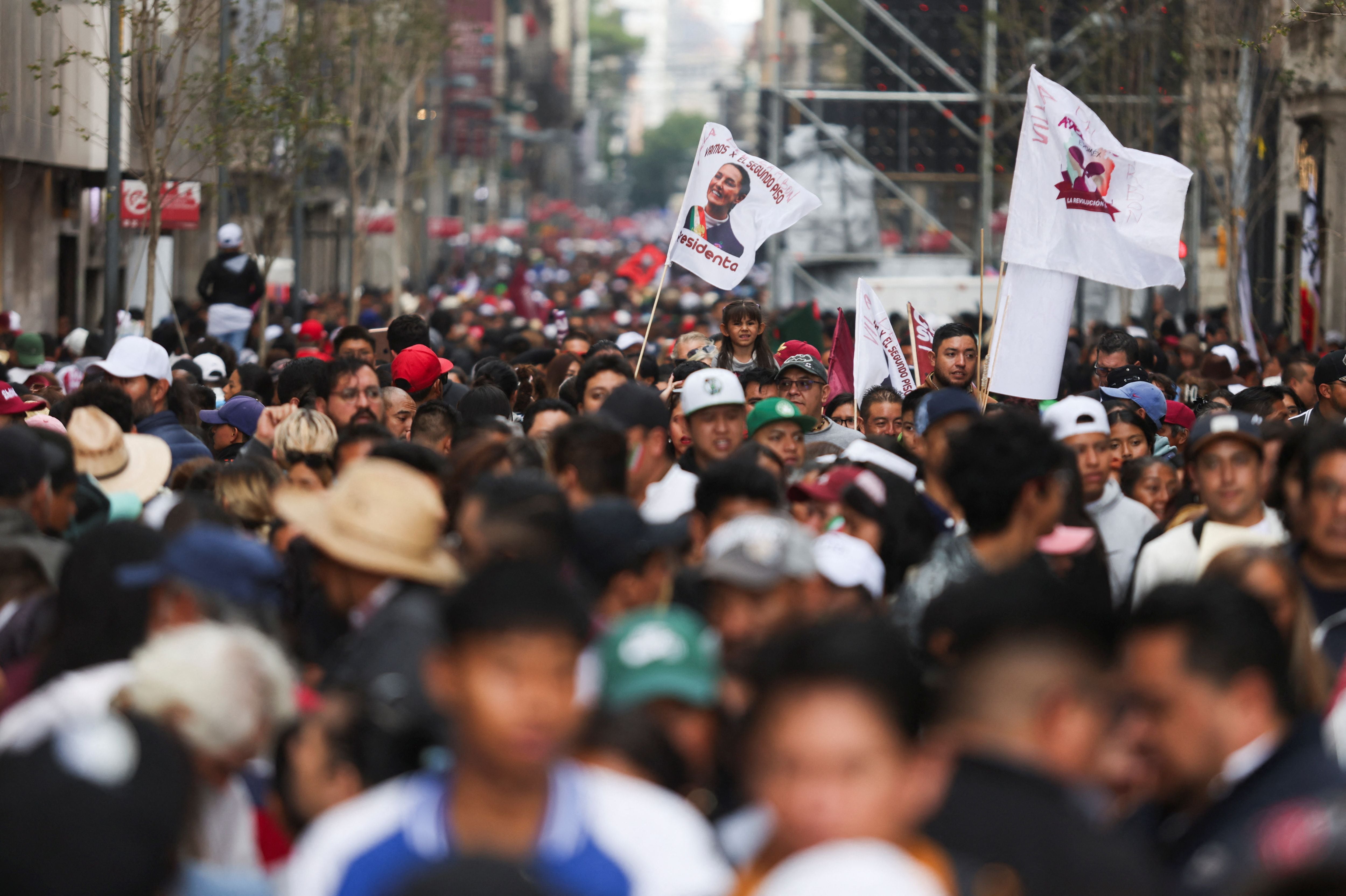 Supporters of Mexico's new President Claudia Sheinbaum arrive for a ceremony where she will receive the 