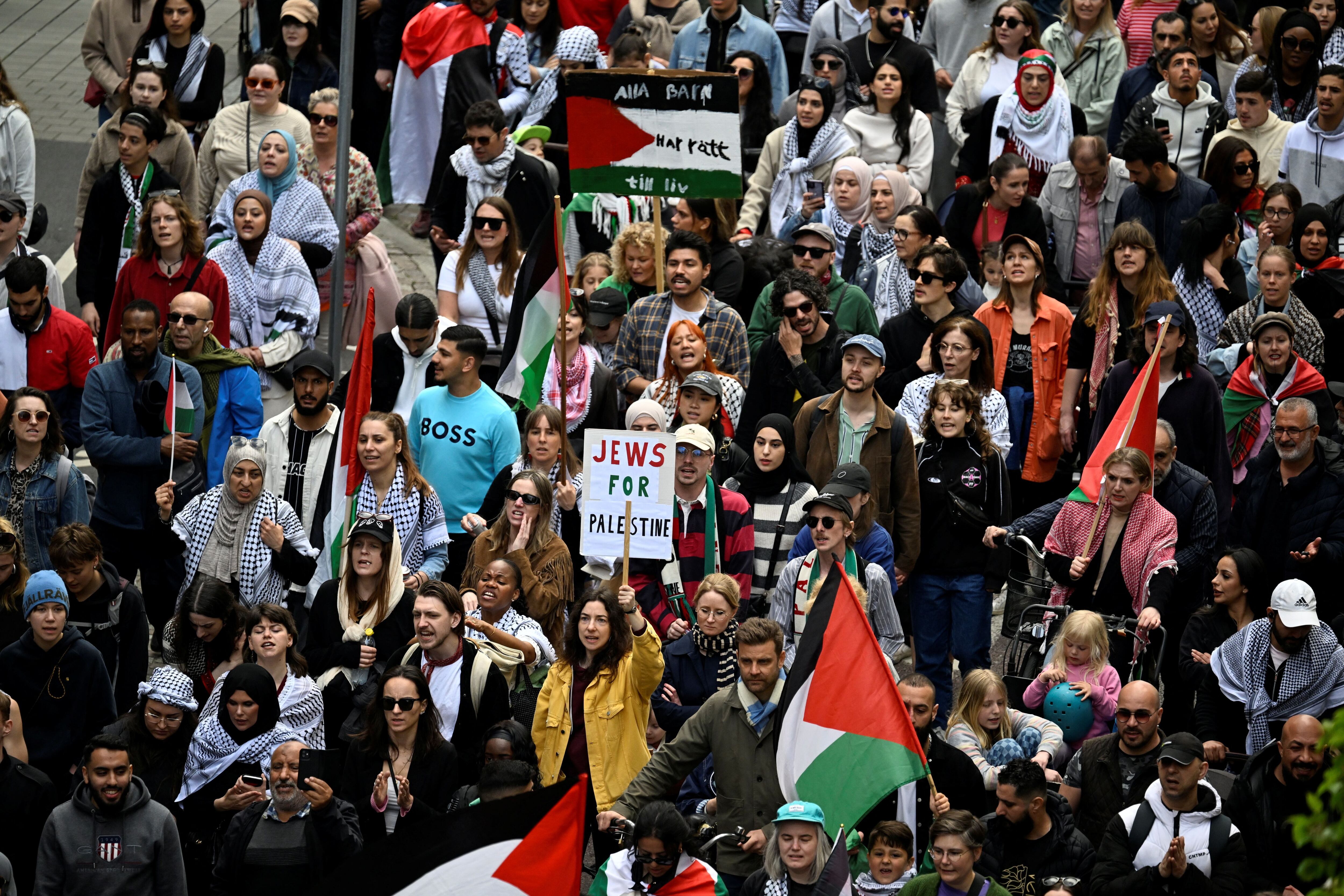 Protesters hold Palestinian flags and signs during the "Stop Israel" demonstration, against Israel's participation in the Eurovision Song Contest due to its ongoing offensive in Gaza against Hamas, in Malmo, Sweden, May 11, 2024. TT News Agency/Johan Nilsson via REUTERS ATTENTION EDITORS - THIS IMAGE WAS PROVIDED BY A THIRD PARTY. SWEDEN OUT. NO COMMERCIAL OR EDITORIAL SALES IN SWEDEN.