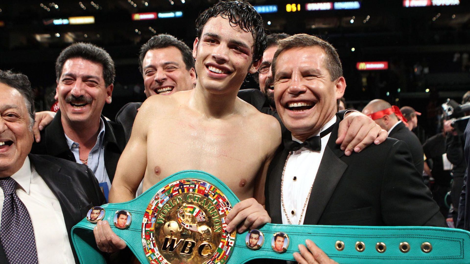 June 4, 2011, Los Angeles,Ca. --- Julio Cesar Chavez Jr.(ctr)poses with his father legendary Julio Cesar Chavez (R)after defeatng Sebastian Zbik by 12-round majority decision to win the WBC World Middleweight title Saturday at Staples Center in Los Angeles. --- Photo Credit : Chris Farina - Top Rank (no other credit allowed) copyright 2011