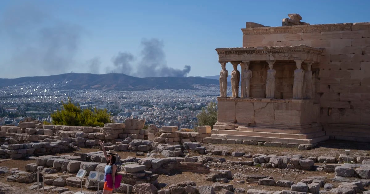 Greece closed the Acropolis and two firefighters died in Italy amid a heat wave across southern Europe