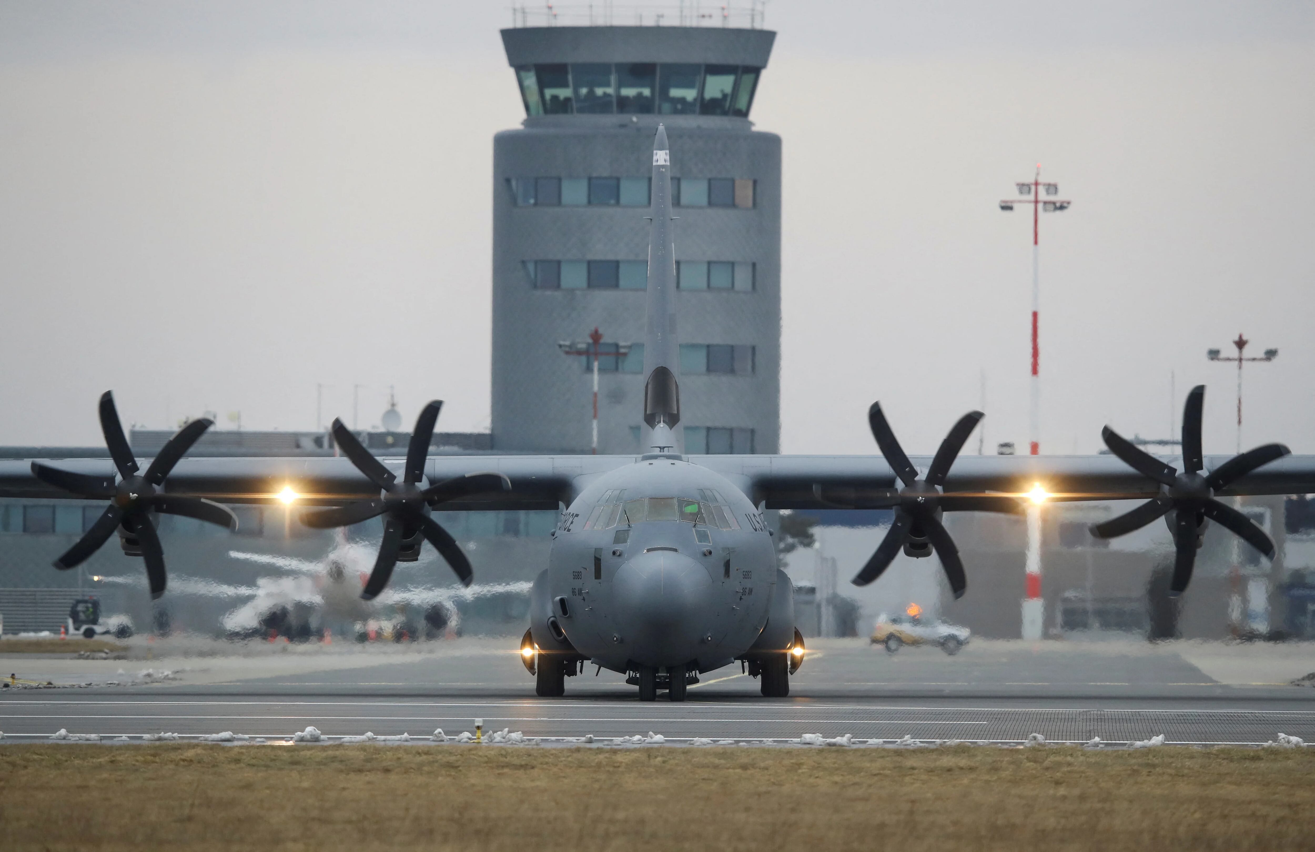 A U.S. Air Force Lockheed Martin C-130 Hercules transport aircraft taxis on the tarmac after landing at Jasionka Airport near Rzeszow, Poland February 4, 2022. REUTERS/Kacper Pempel