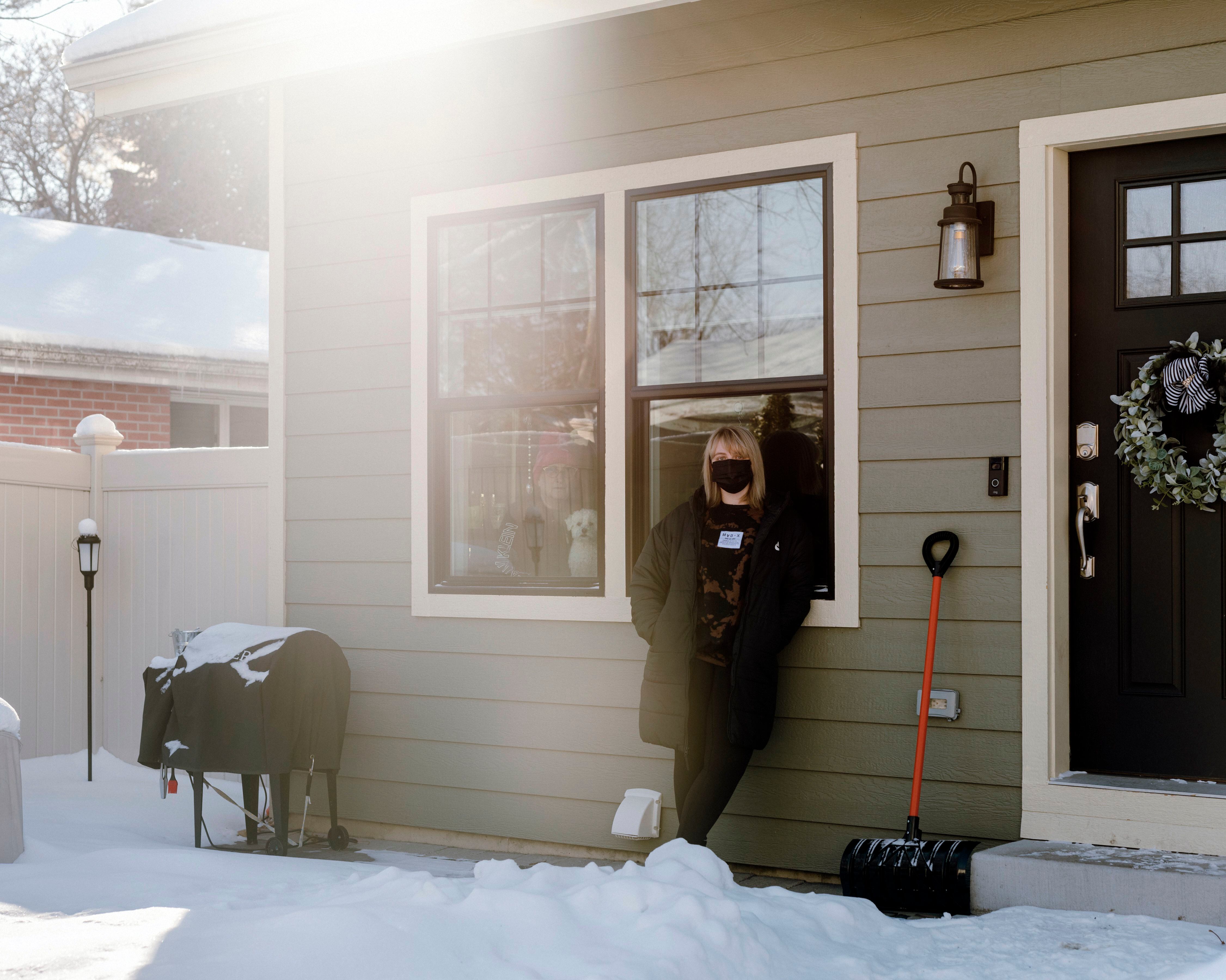 Catherine Sharp, a freelance photographer based in Brooklyn, at the home of her mother in Morris, Ill., on Feb. 6, 2021.  Sharp has spent many weeks trying to get her parents the vaccine. (Lyndon French/The New York Times)