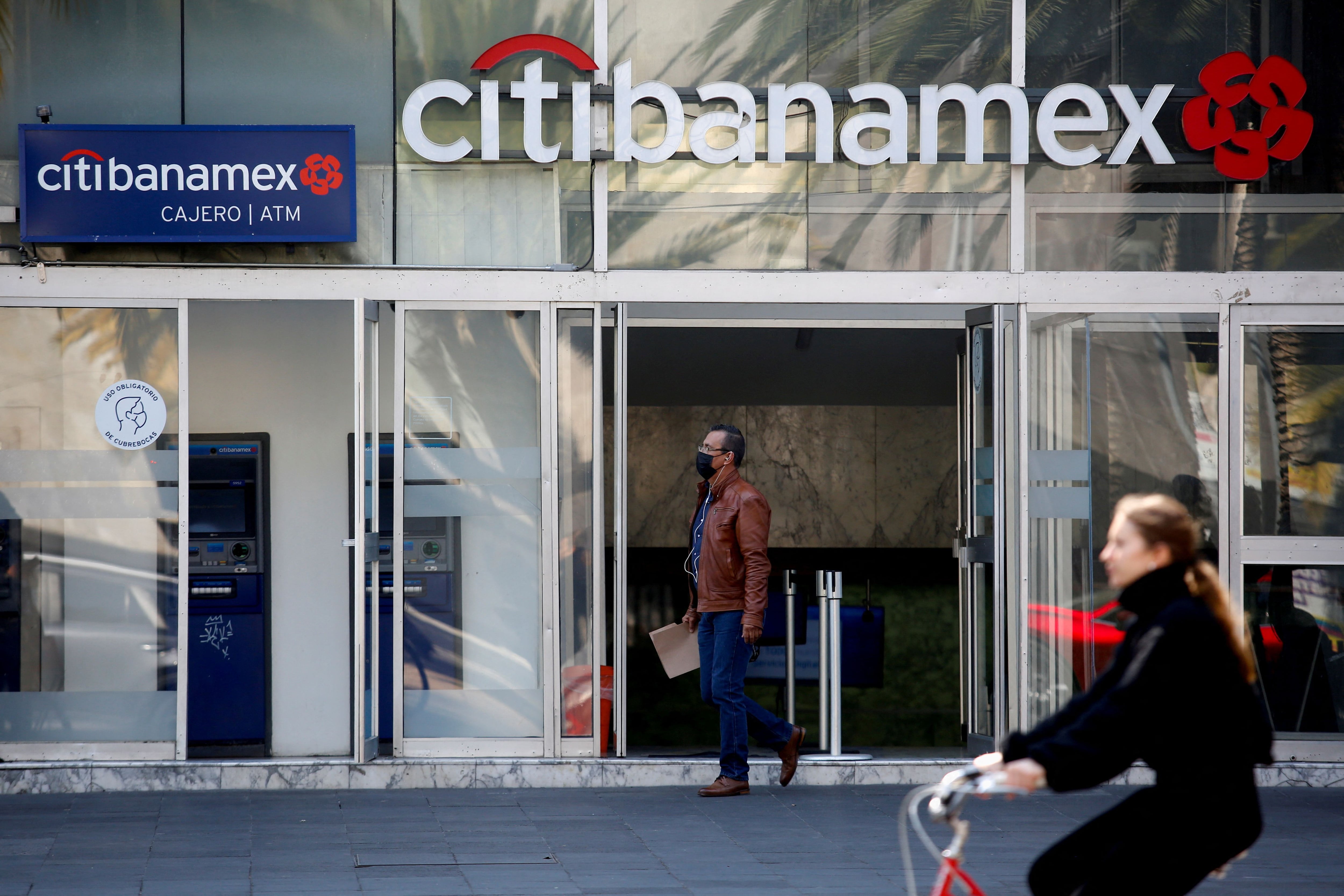 FILE PHOTO: A man walks out of a branch of Citibanamex bank in Mexico City, Mexico January 13, 2022. REUTERS/Gustavo Graf/File Photo/File Photo