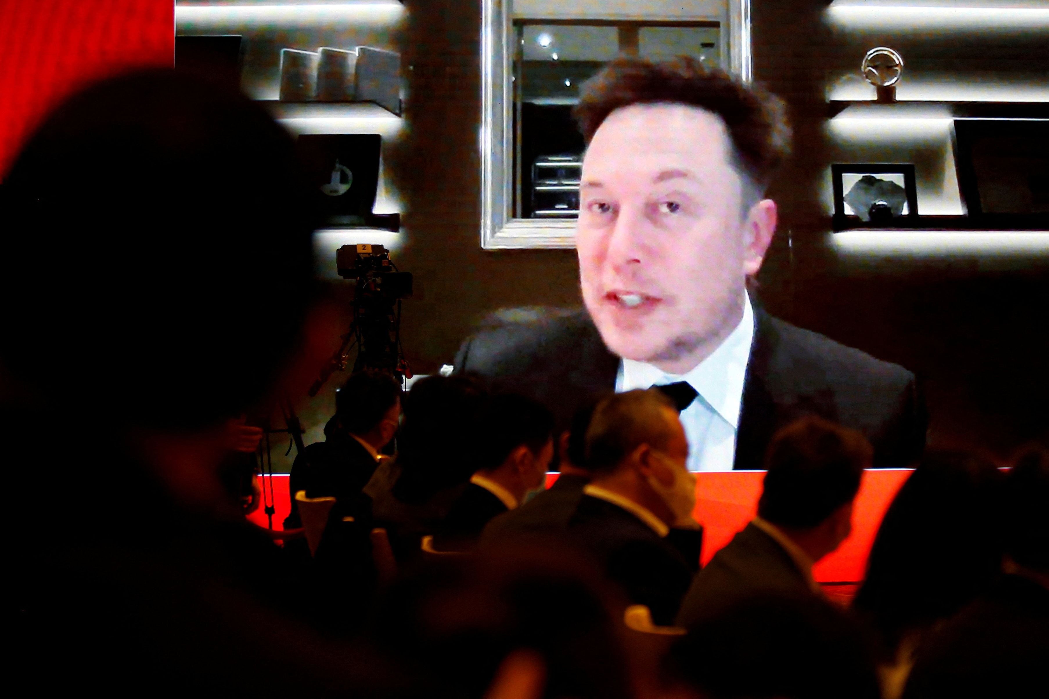 FOTO DE ARCHIVO: El director ejecutivo de Tesla Inc, Elon Musk, asiste a través de un enlace de video a una sesión en el Foro de Desarrollo de China celebrado en Beijing, China, el 20 de marzo de 2021. REUTERS/Roxanne Liu/File Photo