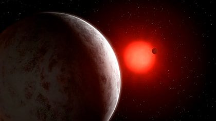 Recreación del sistema planetario en torno a la estrella Gliese 887 (Mark Garlick)