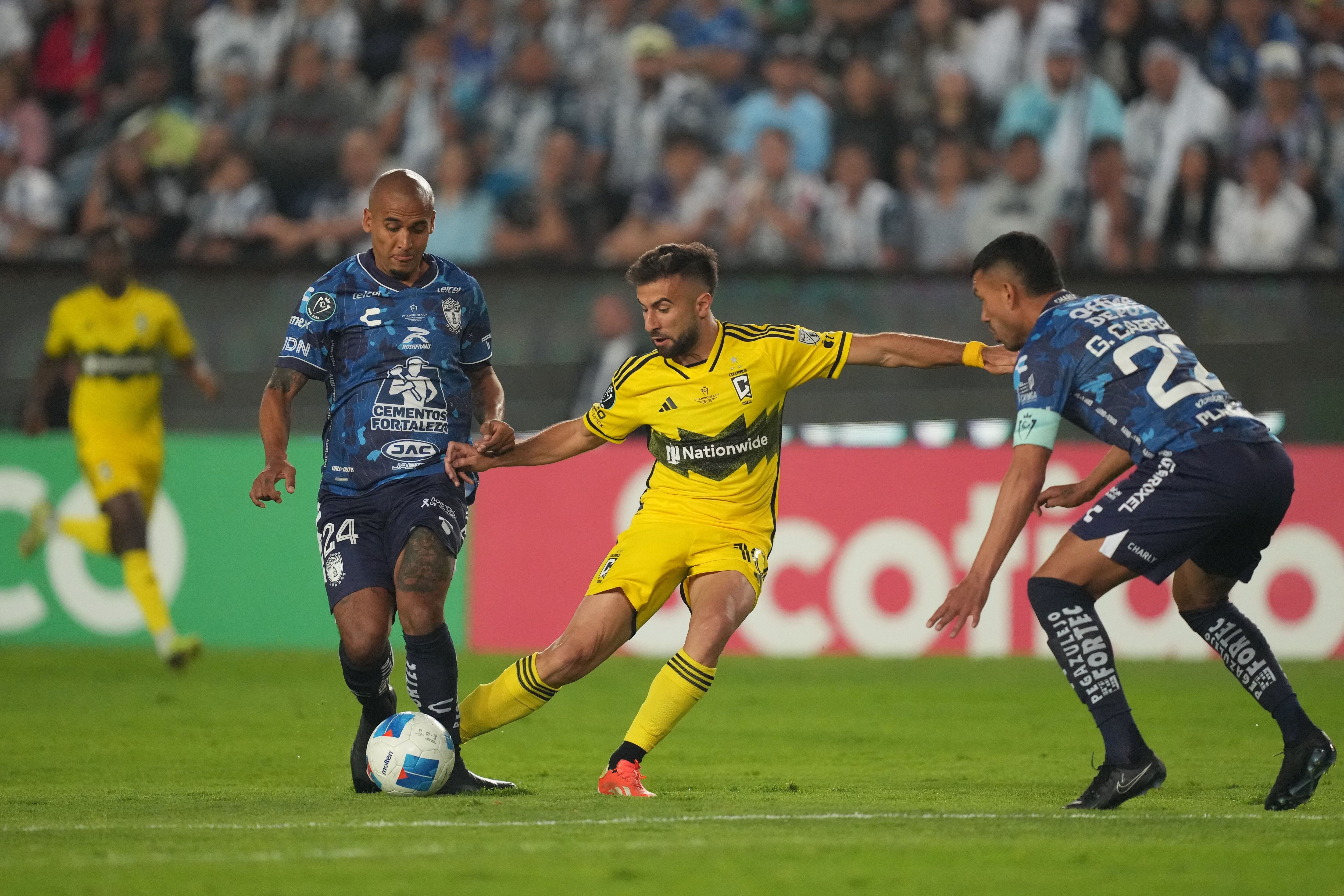 Jun 1, 2024; Pachuca, Hidalgo, Mexico;  CF Pachuca defender Luis Rodriguez (24) and Columbus Crew forward Diego Rossi (10) battle for the ball in the first half in the 2024 CONCACAF Champions Cup Championship at Estadio Hidalgo. Mandatory Credit: Kirby Lee-USA TODAY Sports