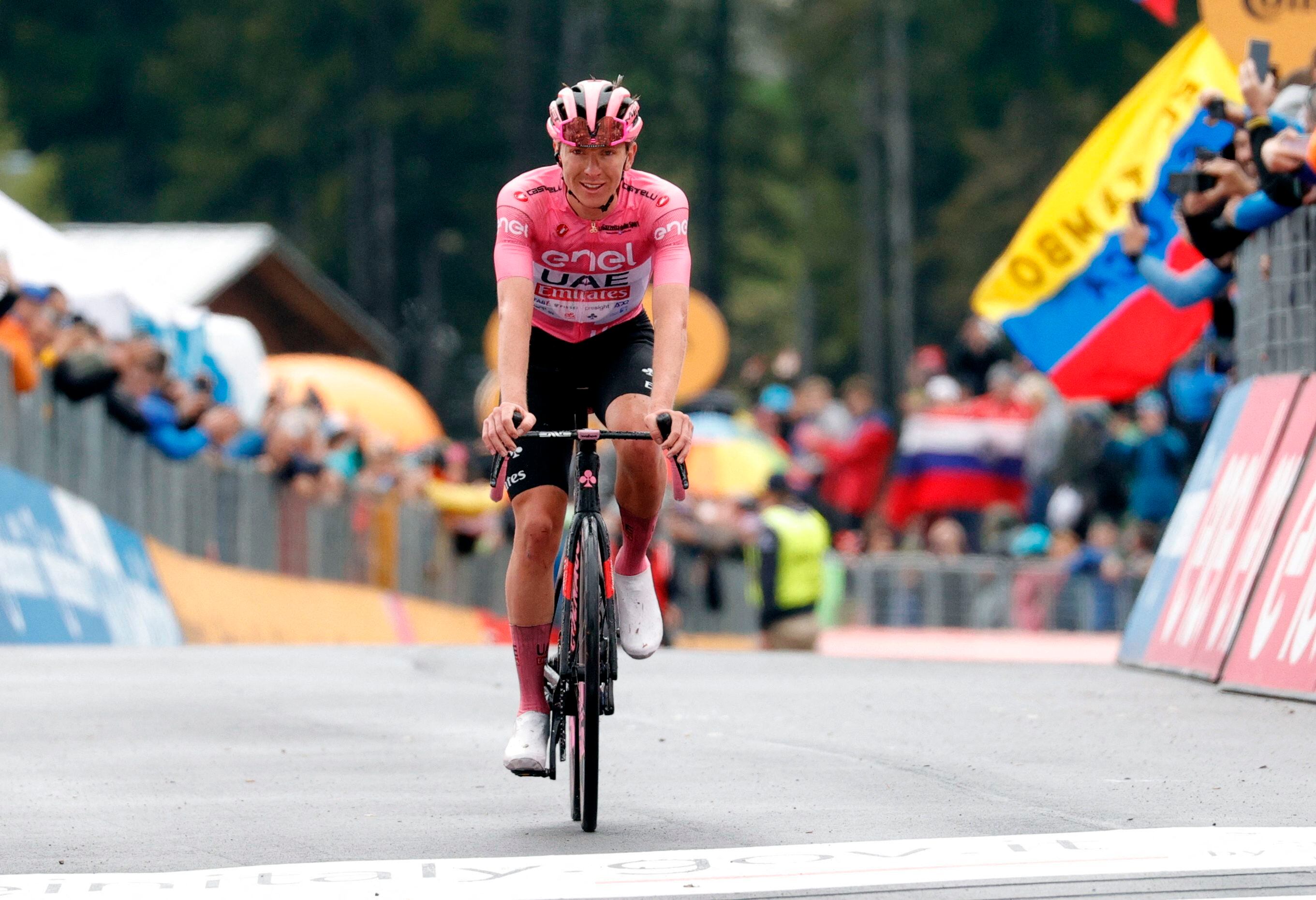 Cycling - Giro d'Italia - Stage 17 - Selva di Val Gardena/Wolkenstein in Groden to Passo del Brocon - Italy - May 22, 2024 UAE Team Emirates' Tadej Pogacar wearing the maglia rosa jersey as he crosses the line to finish second in stage 17 REUTERS/Ciro De Luca