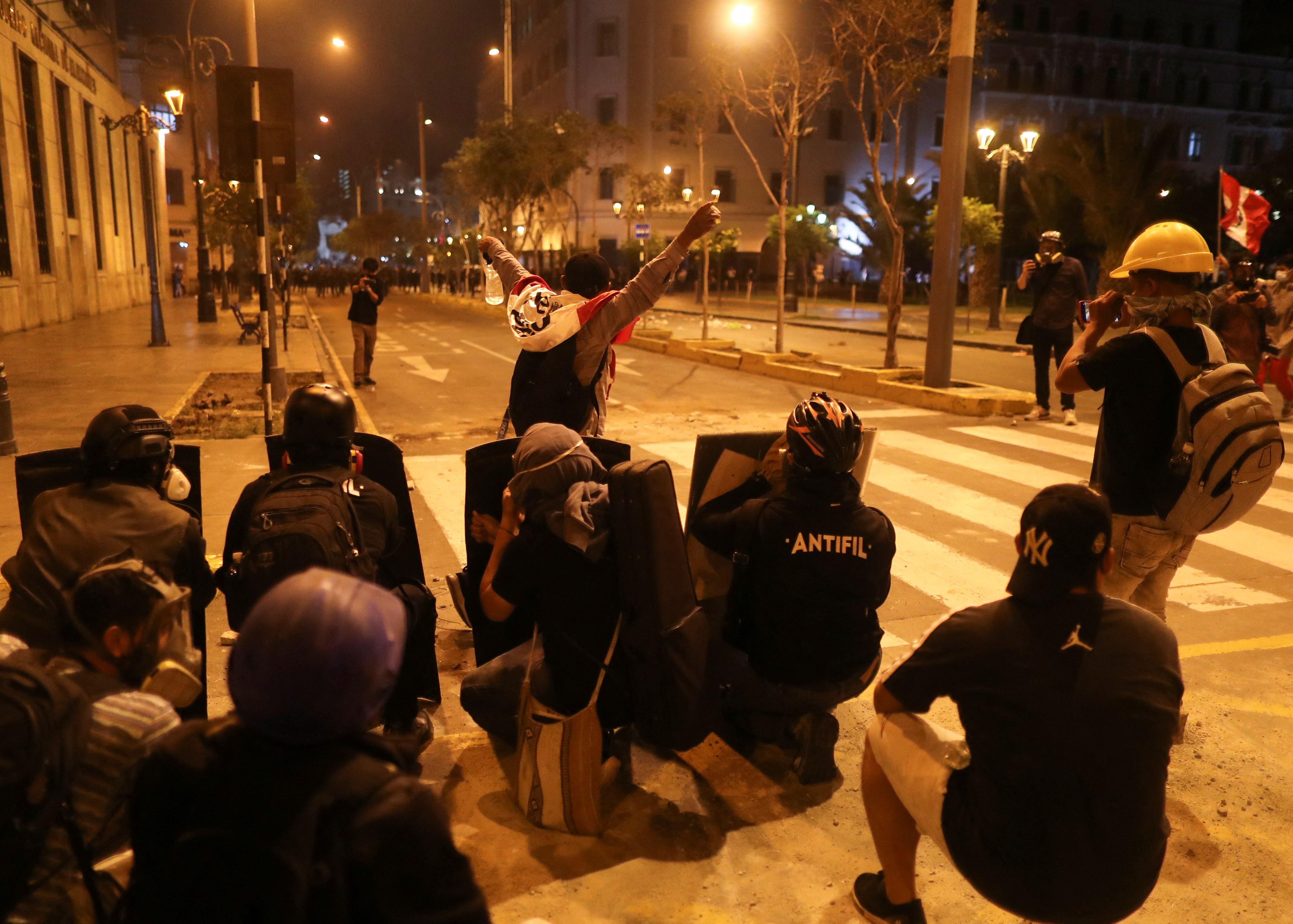 Demonstrators protest demanding the dissolution of Congress and to hold democratic elections rather than recognize Dina Boluarte as Peru's President, after the ousting of Peruvian President Pedro Castillo, in Lima, Peru December 12, 2022. REUTERS/Sebastian Castaneda