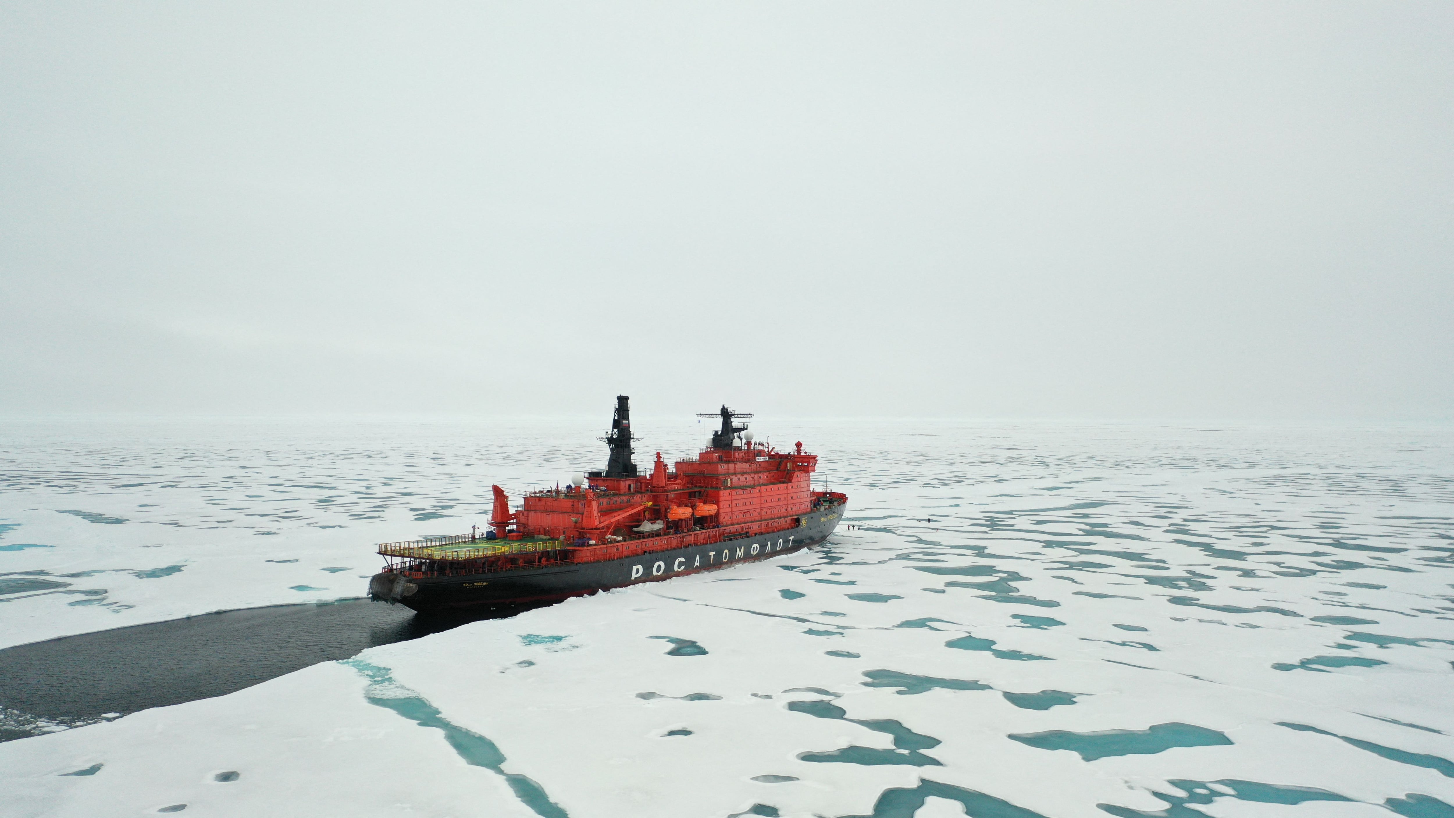 (FILES) The Russian "50 Years of Victory" nuclear-powered icebreaker is seen at the North Pole on August 18, 2021. From major investments to a built-up military presence, Russia has been making moves left and right in its drive to open a northern maritime route linking Asia and Europe. Moscow hopes these Arctic ambitions, made possible by global warming and the consequent melting glaciers, will enable it to redirect its hydrocarbons -- now under Western sanctions -- to Asia. Faced with challenges to the economy, Russian President Vladimir Putin has called the development of the Northern Sea Route "one of the obvious strategic priorities". (Photo by Ekaterina ANISIMOVA / AFP)