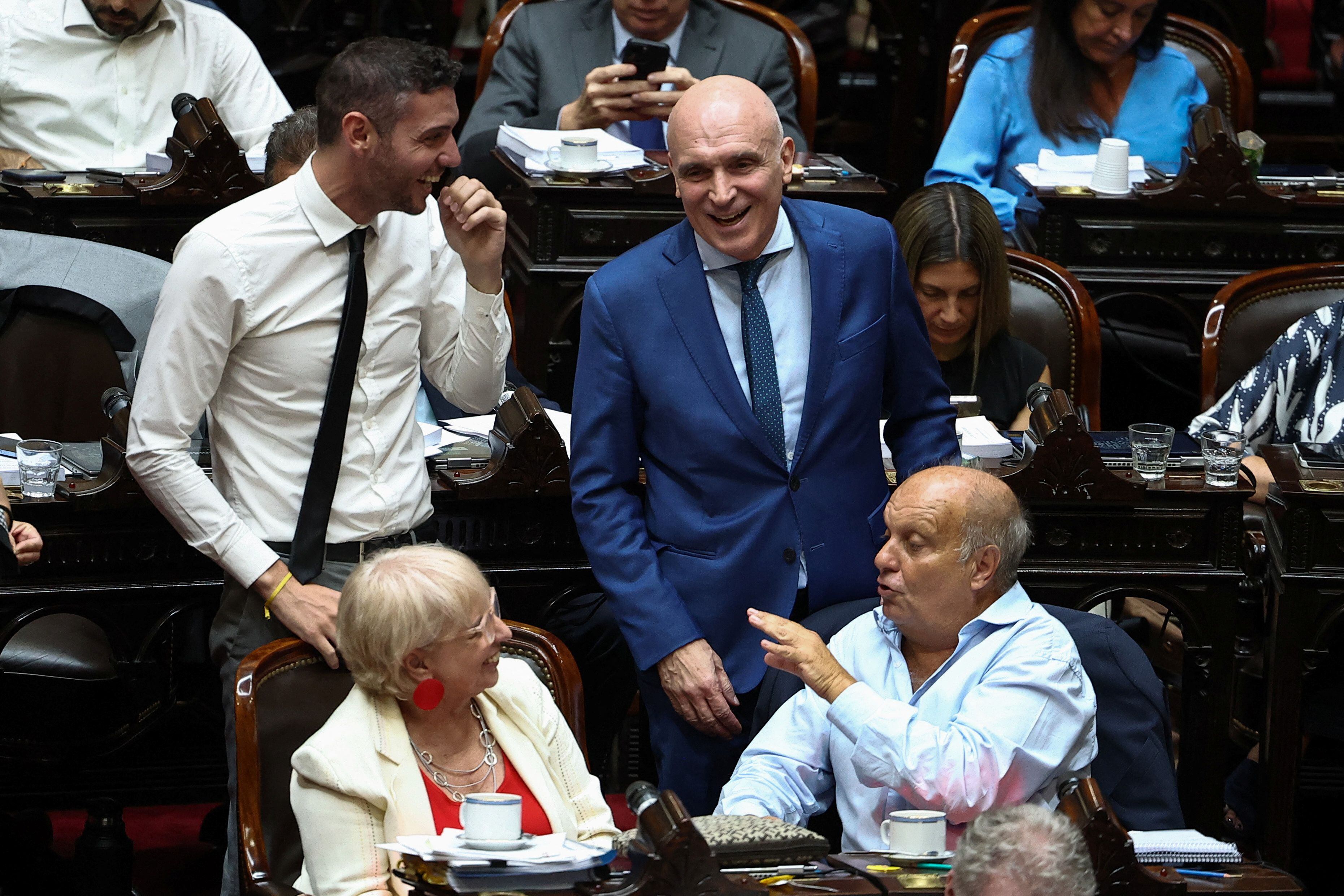 Argentinian politicians Damian Arabia, Jose Luis Espert and Hernan Lombardi speak during a debate on Argentina's President Javier Milei's economic reform bill, known as the 'omnibus bill', at the National Congress, in Buenos Aires, Argentina, February 2, 2024. REUTERS/Agustin Marcarian