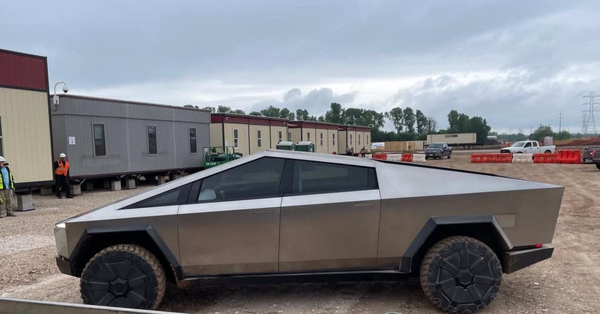 The Elon Musk truck drives a Tesla Cybertruck to the factory where the vehicle is mass-produced