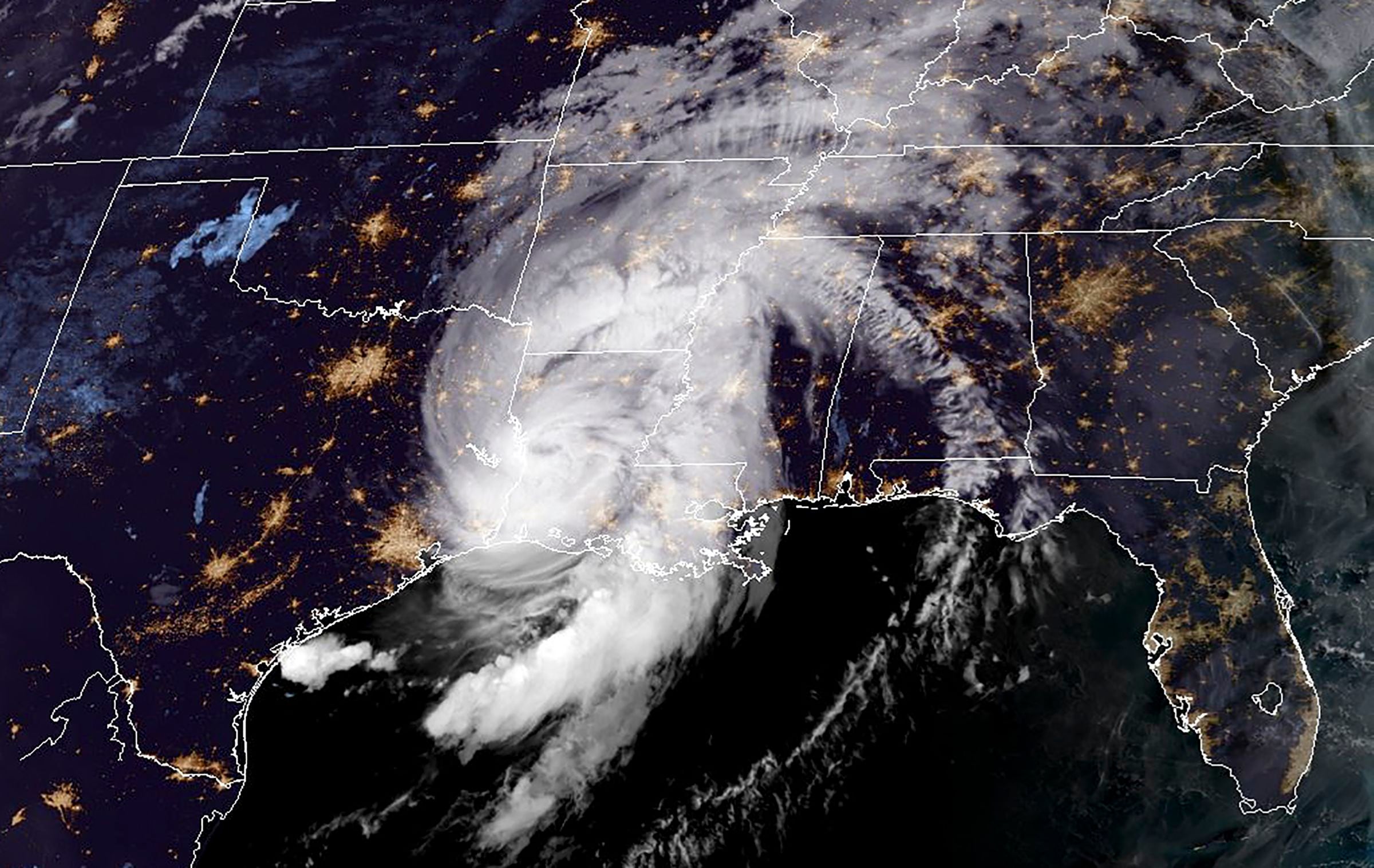 This NOAA/GOES satellite image shows Hurricane Laura over the US state of Louisiana, near the line of US state Texas at 11:50 UTC, on August 27, 2020. - Hurricane Laura slammed into the southern US state of Louisiana Thursday and the monster category 4 storm prompted warnings of "unsurvivable" ocean surges and evacuation orders for hundreds of thousands of Gulf Coast residents. The National Hurricane Center (NHC) said "extremely dangerous" Laura would bring winds of 150 miles per hour (240 kilometers per hour) and "destructive waves will cause catastrophic damage" to Louisiana and Texas. (Photo by Handout / NOAA/GOES / AFP) / RESTRICTED TO EDITORIAL USE - MANDATORY CREDIT "AFP PHOTO / NOAA/GOES" - NO MARKETING - NO ADVERTISING CAMPAIGNS - DISTRIBUTED AS A SERVICE TO CLIENTS