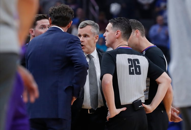 Mar 11, 2020; Oklahoma City, Oklahoma, USA; Officials talk to Oklahoma City Thunder head coach Billy Donovan (center) before tip off of a game against the Utah Jazz at Chesapeake Energy Arena. The game has been postponed to a later date. Mandatory Credit: Alonzo Adams-USA TODAY Sports