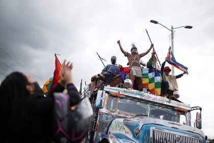 Colombian indigenous people travel on a bus to participate in a protest to ask the Colombian government for security in their territories and to stop massacres and murders of social leaders, during an indigenous meeting called 