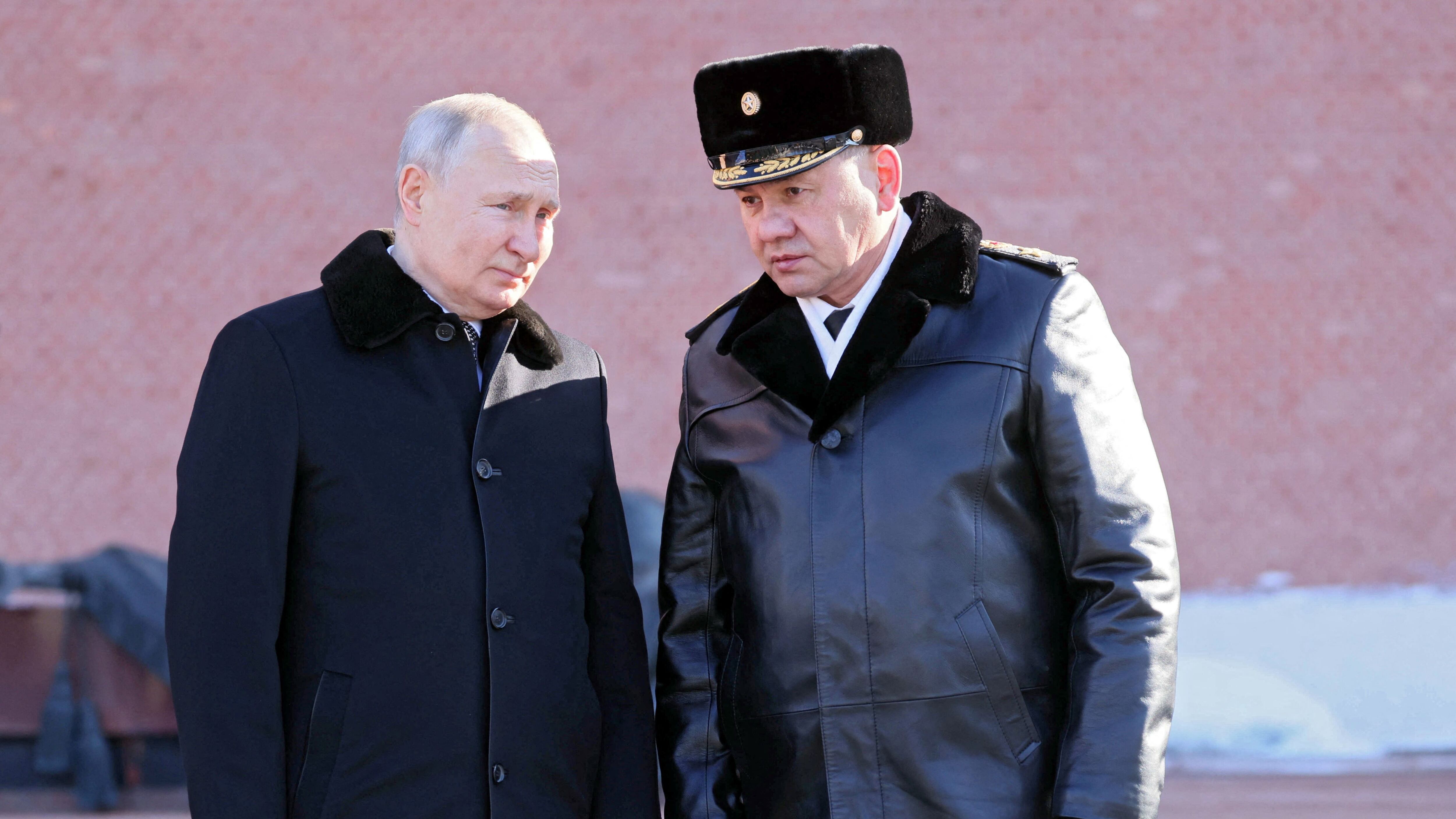 Russian President Vladimir Putin and Defence Minister Sergei Shoigu take part in a wreath laying ceremony at the Tomb of the Unknown Soldier by the Kremlin Wall on the Defender of the Fatherland Day in Moscow, Russia, February 23, 2023. Sputnik/Mikhail Metzel/Pool via REUTERS ATTENTION EDITORS - THIS IMAGE WAS PROVIDED BY A THIRD PARTY.