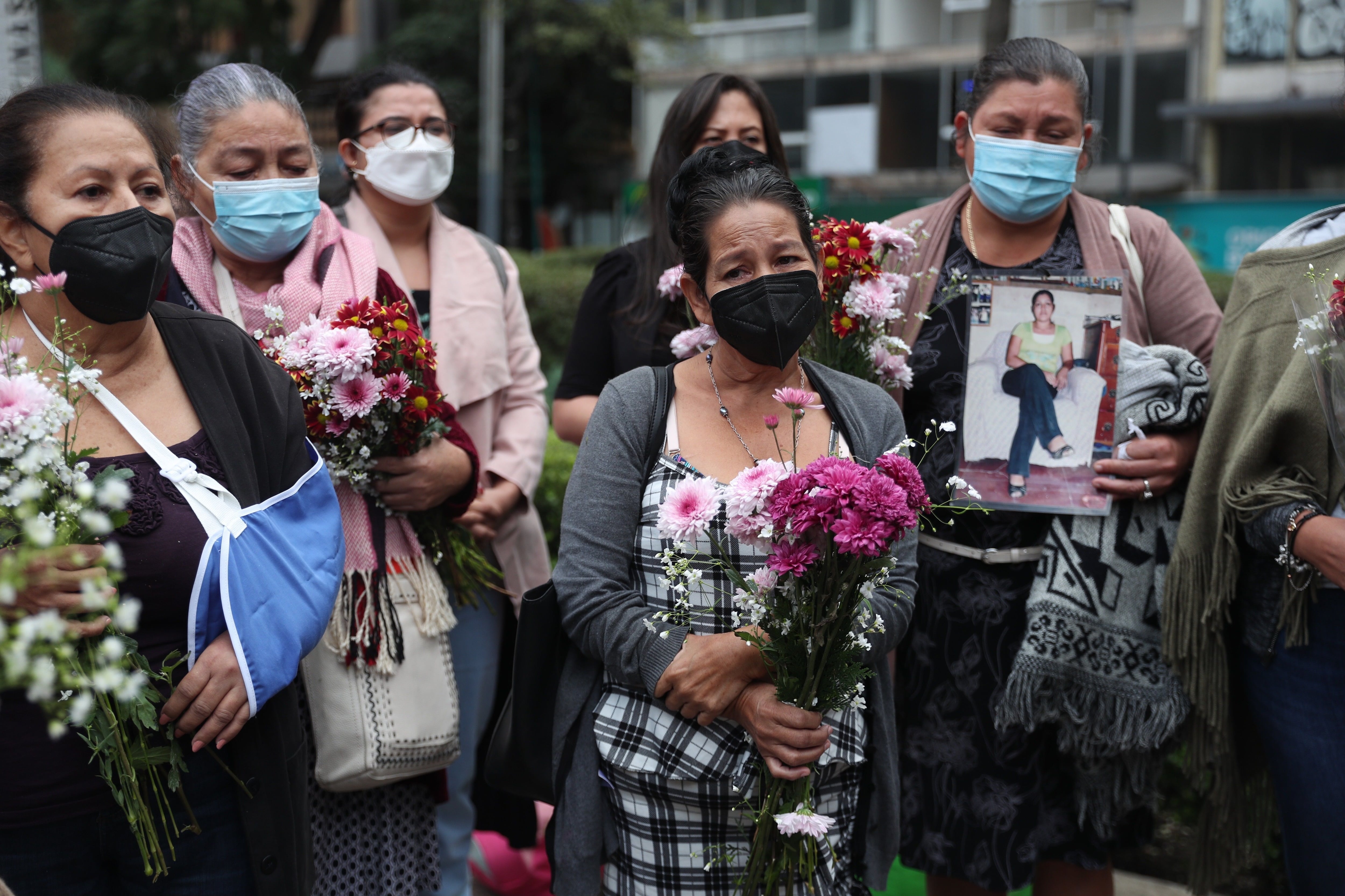 Family members of missing migrants in Mexico ask for justice in a tribute