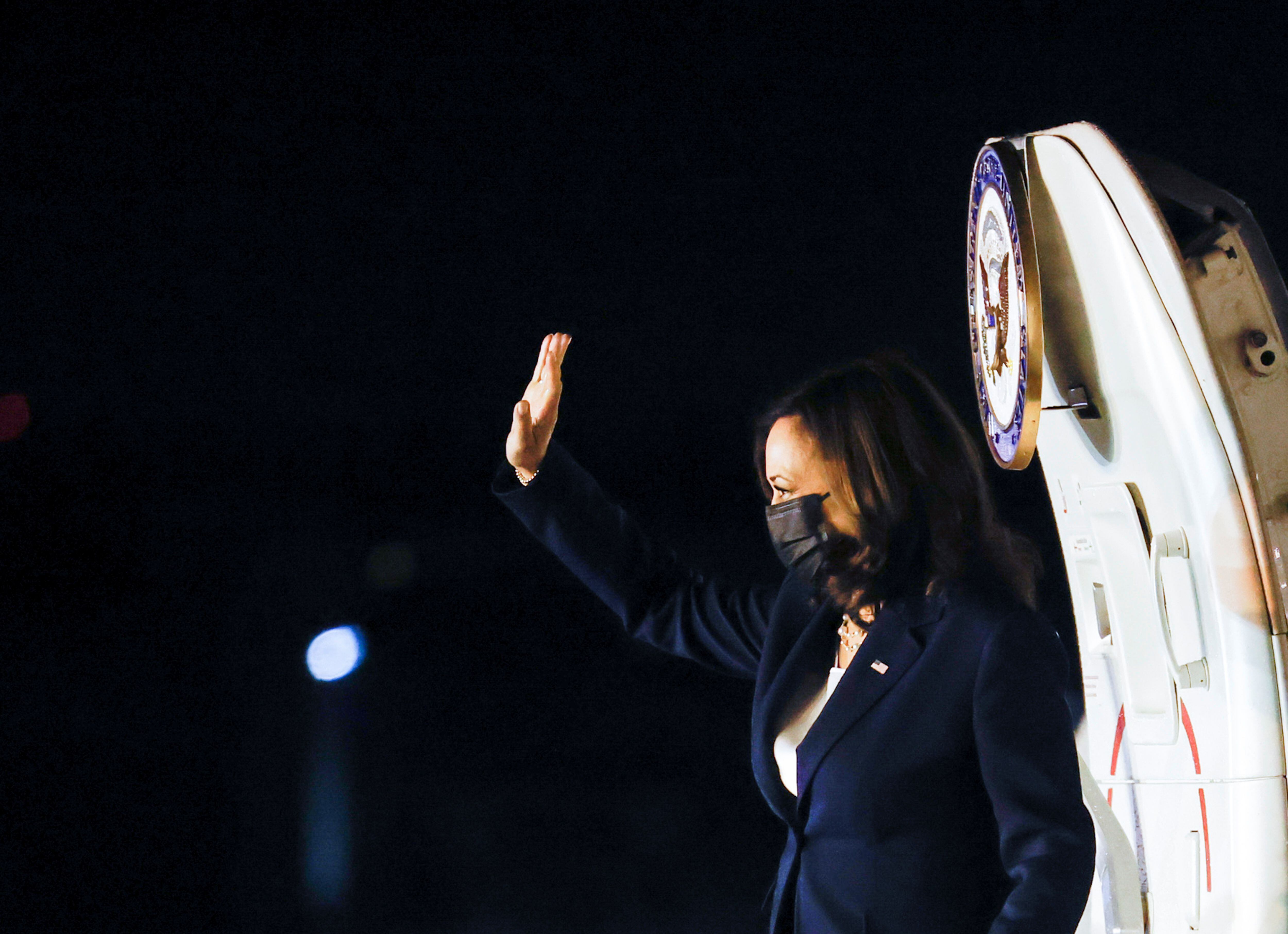 U.S. Vice President Kamala Harris waves as she boards Air Force Two prior to departure at Guatemalan Air Force Central Command, ahead of her visit to Mexico, in Guatemala, June 7, 2021. REUTERS/Carlos Barria