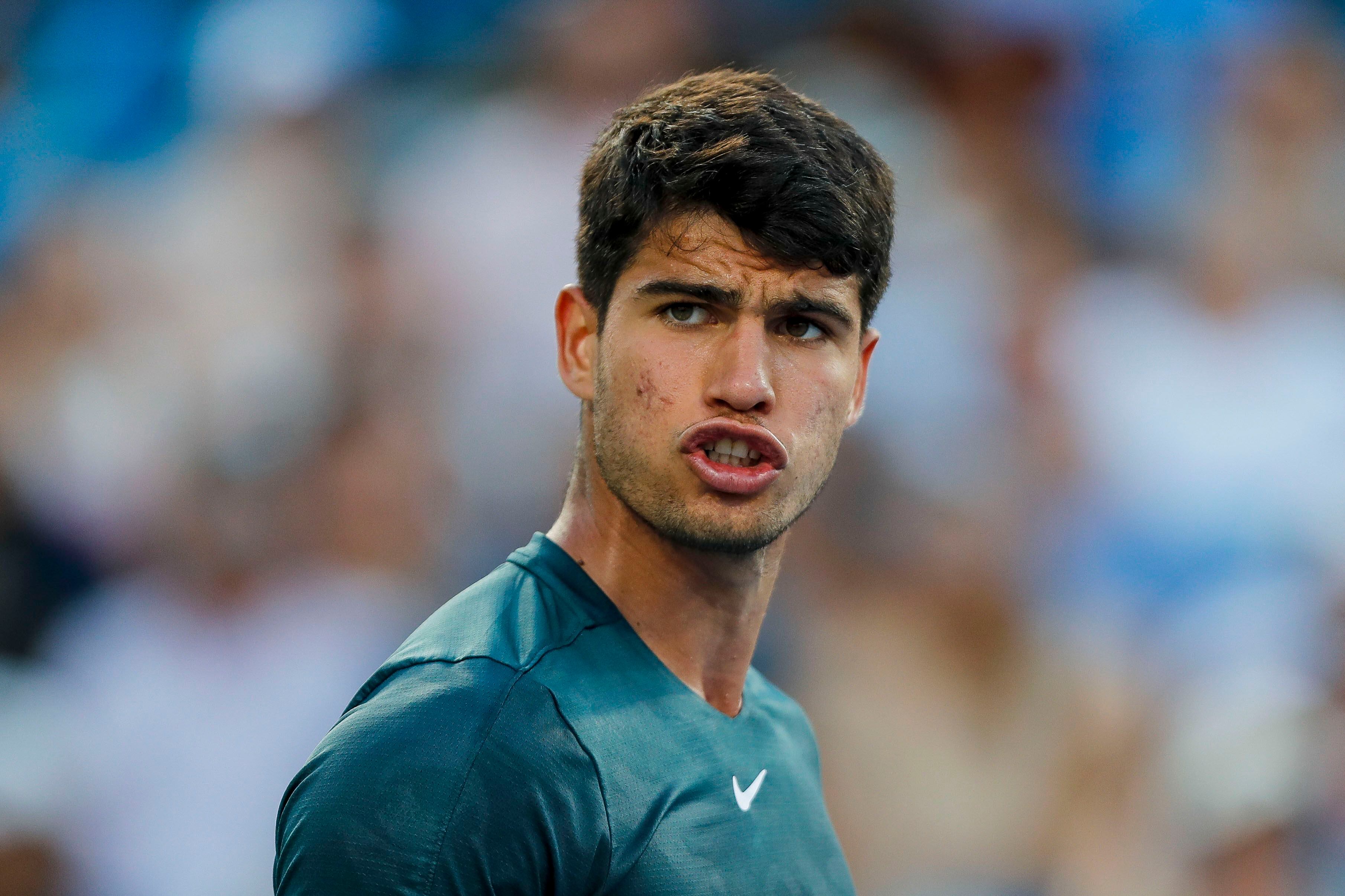 Aug 20, 2023; Mason, OH, USA; Carlos Alcaraz (ESP) reacts after a play during the match against Novak Djokovic (SRB) during the menÕs singles final of the Western and Southern Open tennis tournament at Lindner Family Tennis Center. Mandatory Credit: Katie Stratman-USA TODAY Sports