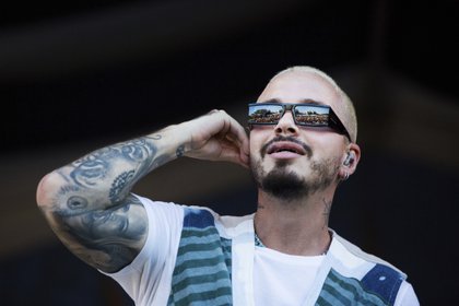 FILE - J Balvin performs at the New Orleans Jazz & Heritage Festival in New Orleans on April 28, 2019. Balvin garnered a whopping 13 nominations at the 2020 Latin Grammy Awards, including two nominations for album of the year and two for record of the year .  (AP Photo / Sophia Germer, file)