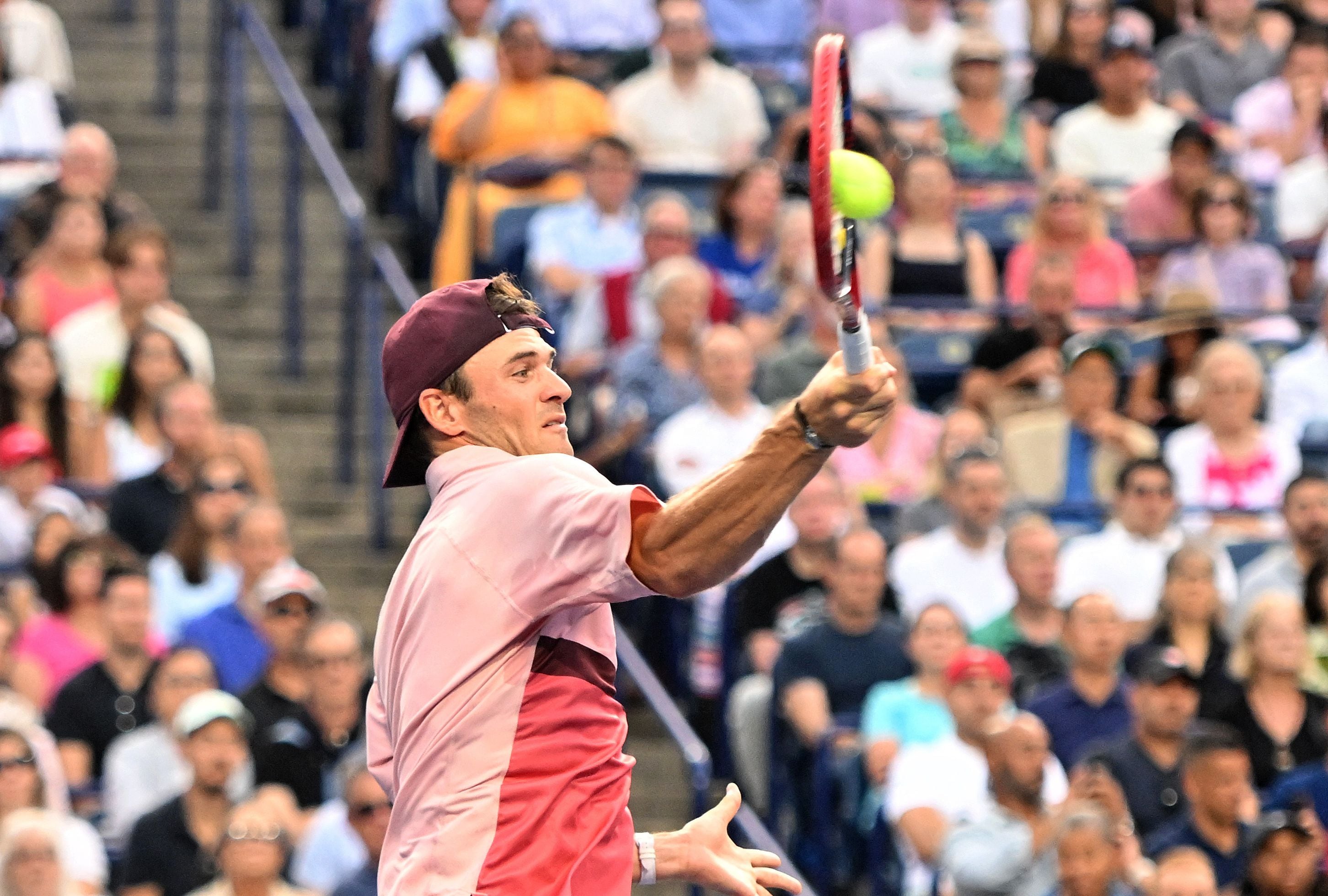 Aug 11, 2023; Toronto, Ontario, Canada;  Tommy Paul (USA)  plays a shot against Carlos Alcaraz (ESP) (not pictured) during quarter finals play at Sobeys Stadium. Mandatory Credit: Dan Hamilton-USA TODAY Sports