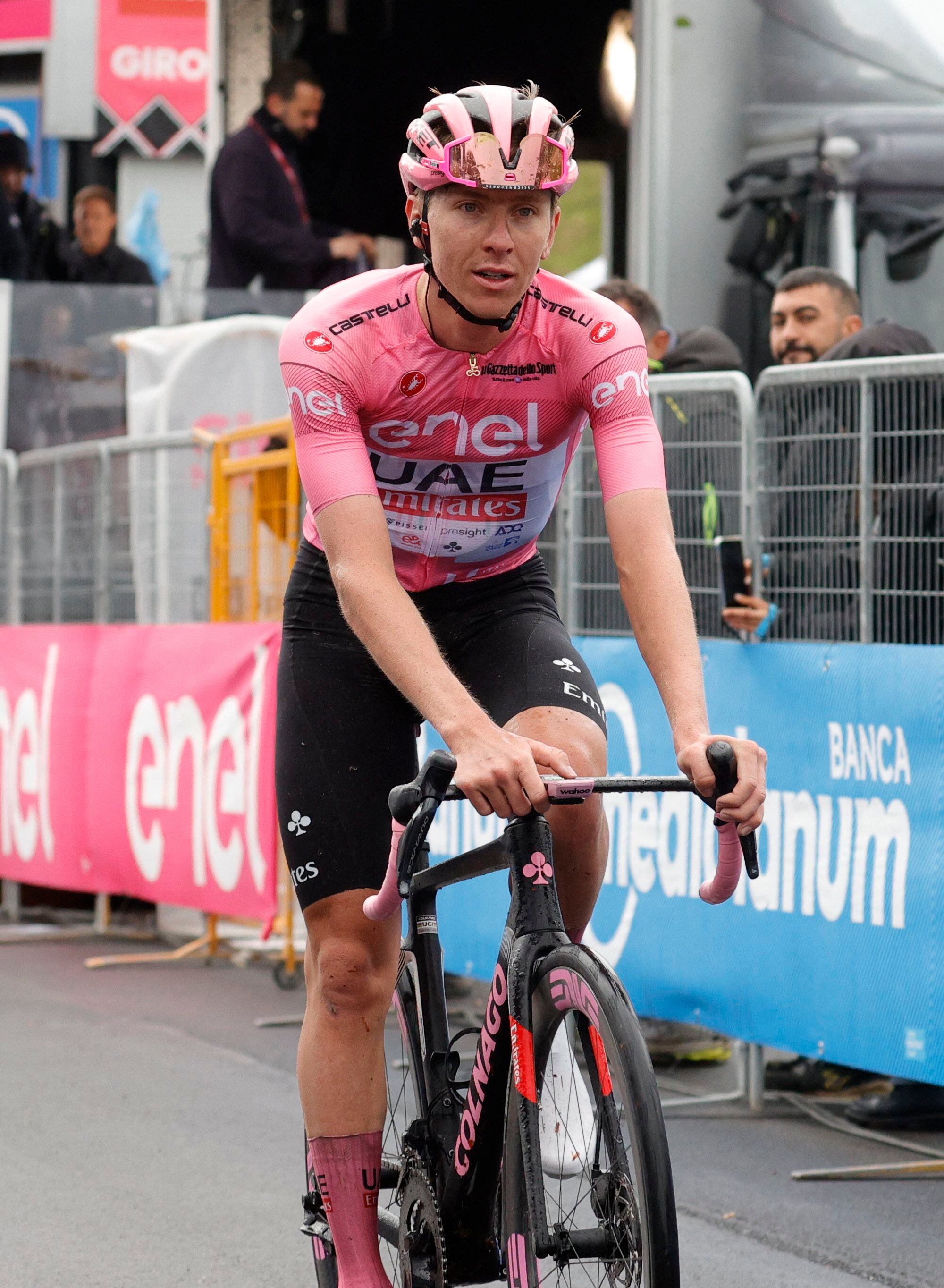 Cycling - Giro d'Italia - Stage 17 - Selva di Val Gardena/Wolkenstein in Groden to Passo del Brocon - Italy - May 22, 2024 UAE Team Emirates' Tadej Pogacar wearing the maglia rosa jersey crosses the line to finish second in stage 17 REUTERS/Ciro De Luca