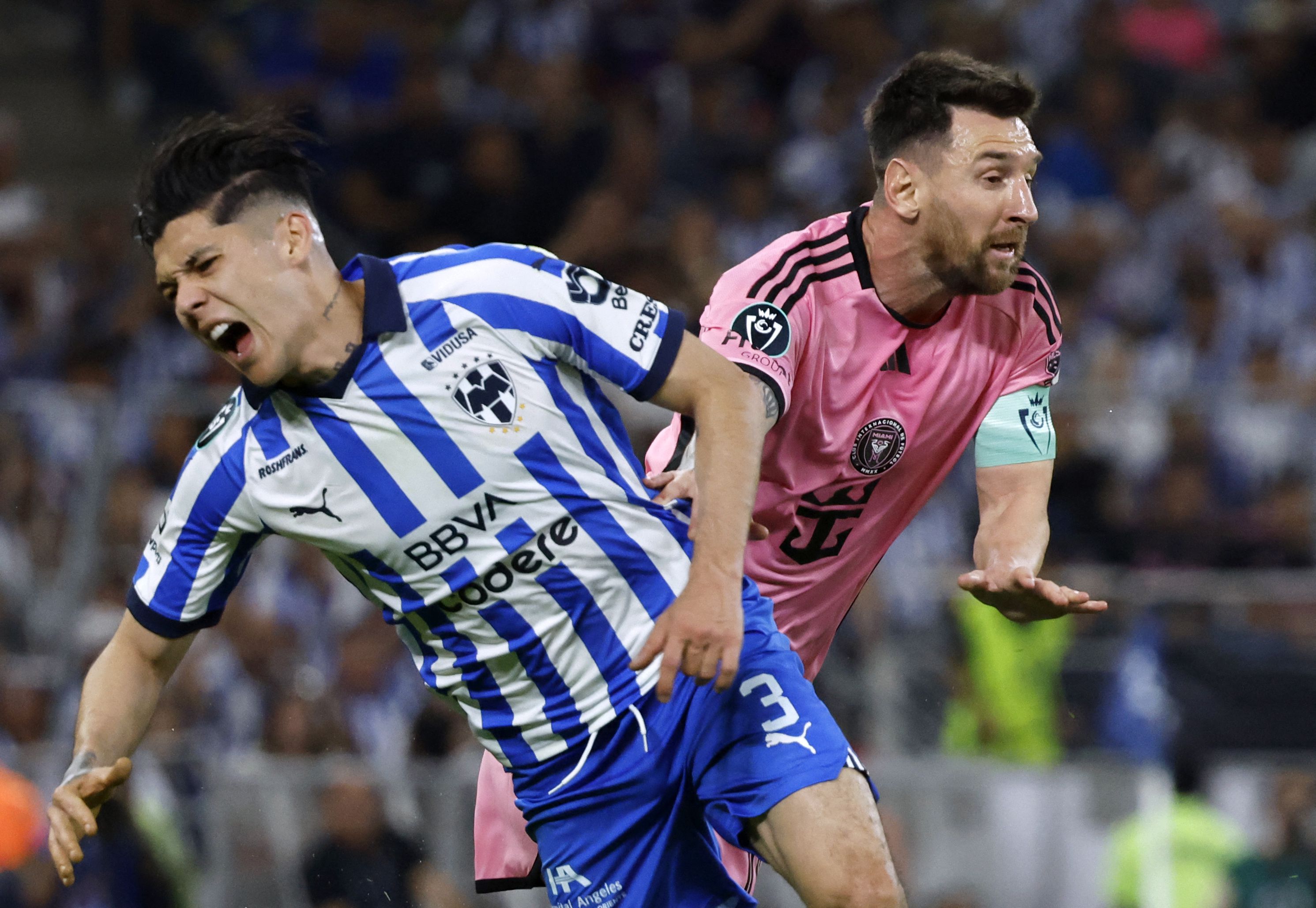 Soccer Football - CONCACAF Champions Cup - Quarter Final - Second Leg - Monterrey v Inter Miami - Estadio BBVA, Monterrey, Mexico - April 10, 2024 Inter Miami's Lionel Messi in action with Monterrey's Gerardo Arteaga REUTERS/Daniel Becerril