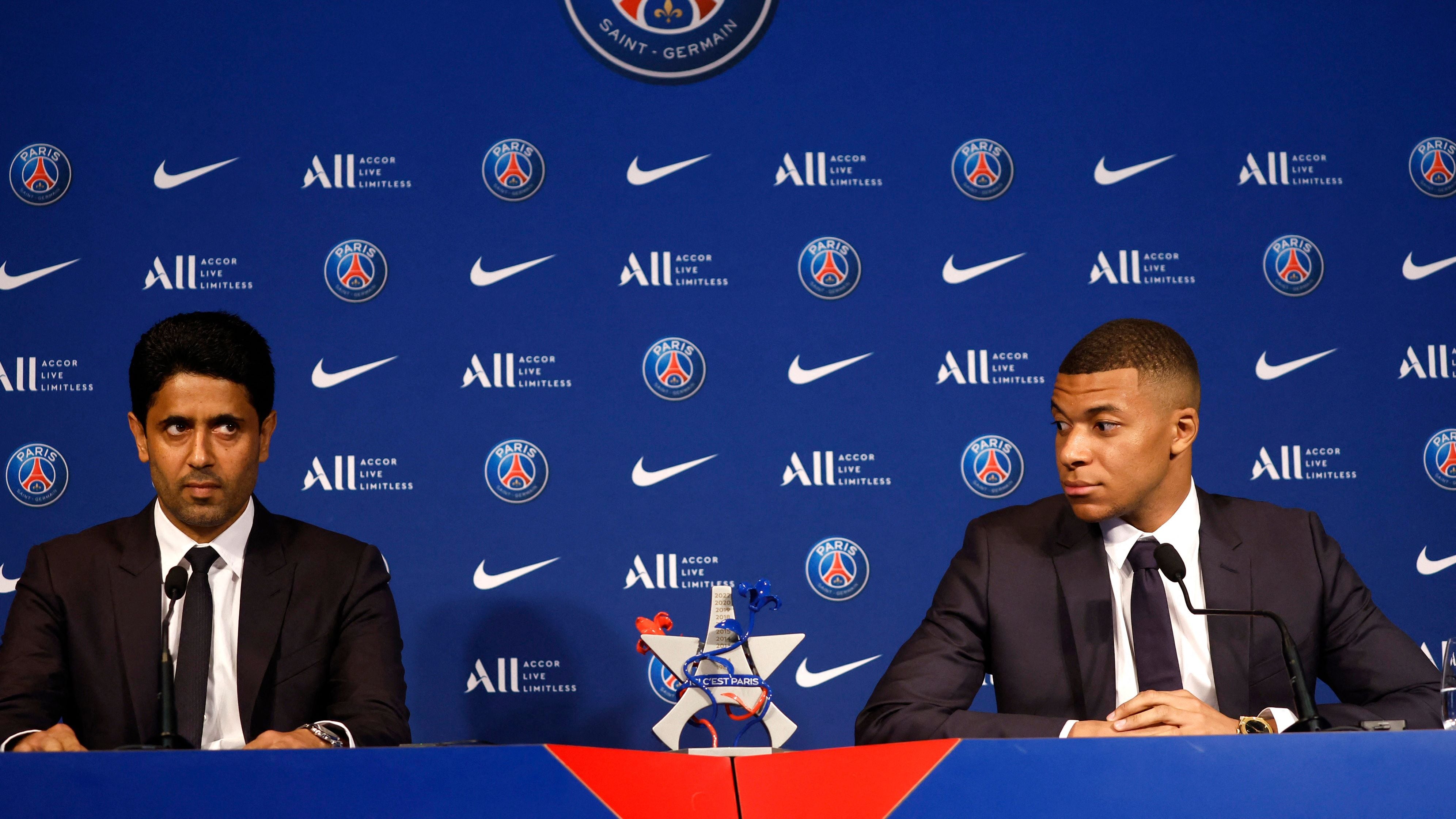 Soccer Football - Paris St Germain Press Conference - Paris, France - May 23, 2022 Paris St Germain's Kylian Mbappe and Paris St Germain president Nasser Al-Khelaifi during the press conference REUTERS/Christian Hartmann