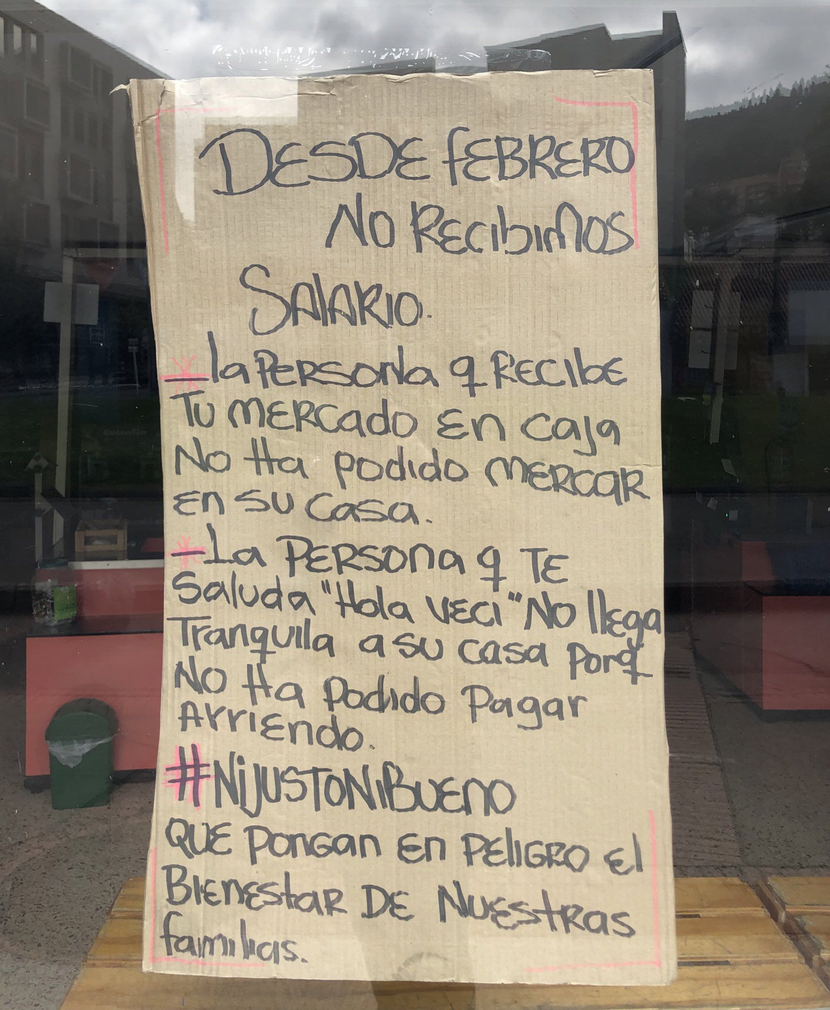 Protest poster for wages owed at Justo y Bueno store