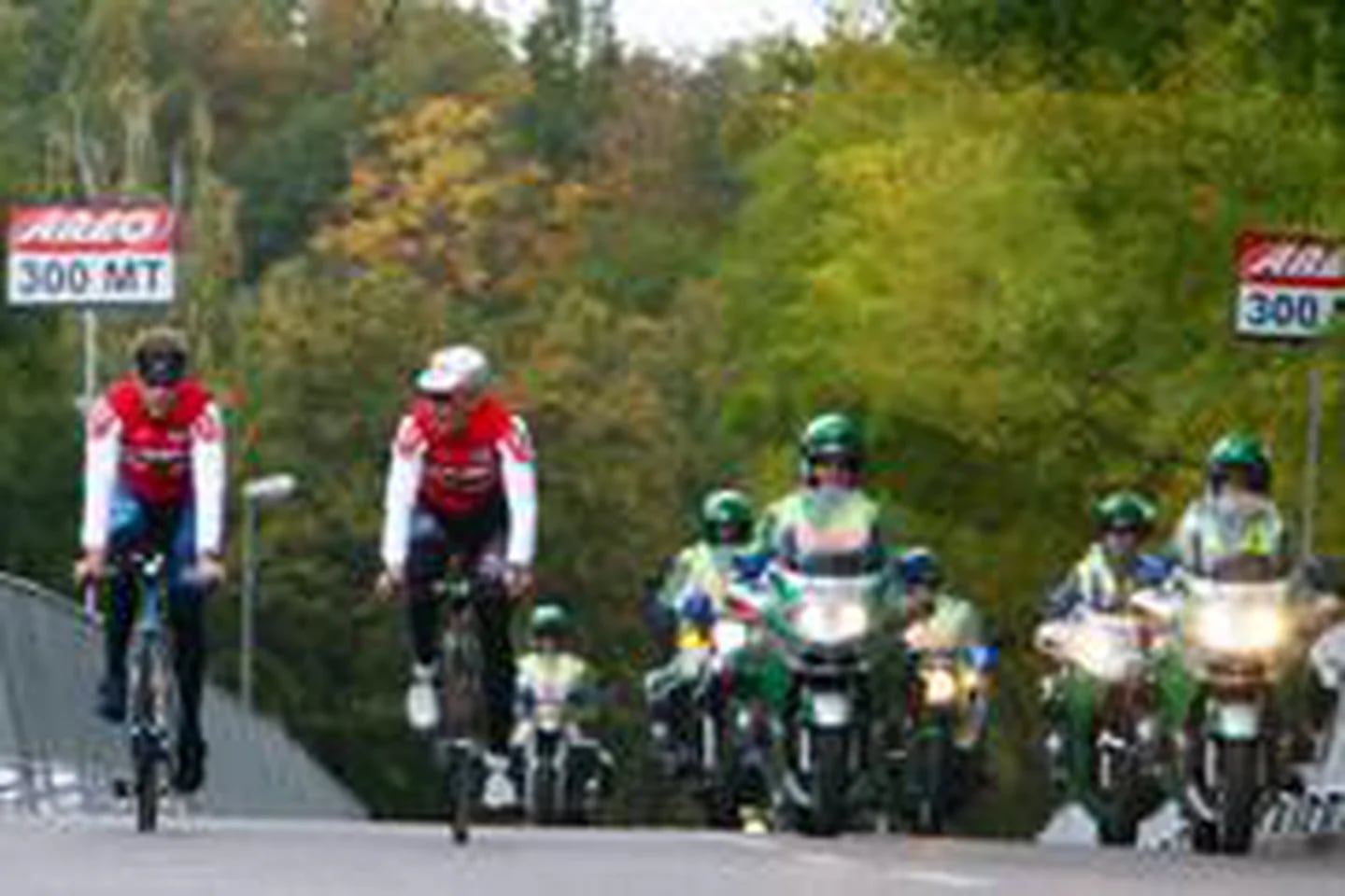 Italy's Olympic champion Paolo Bettini, left, looks at his