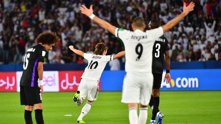 Real Madrid’s Croatian midfielder Luka Modric (C, #10) celebrates his goal during the Final match in the FIFA Club World Cup football competition between Real Madrid and Al-Ain at the Zayed Sports City Stadium in Abu Dhabi, the capital of the United Arab Emirates, on December 22, 2018. (Photo by Giuseppe CACACE / AFP)