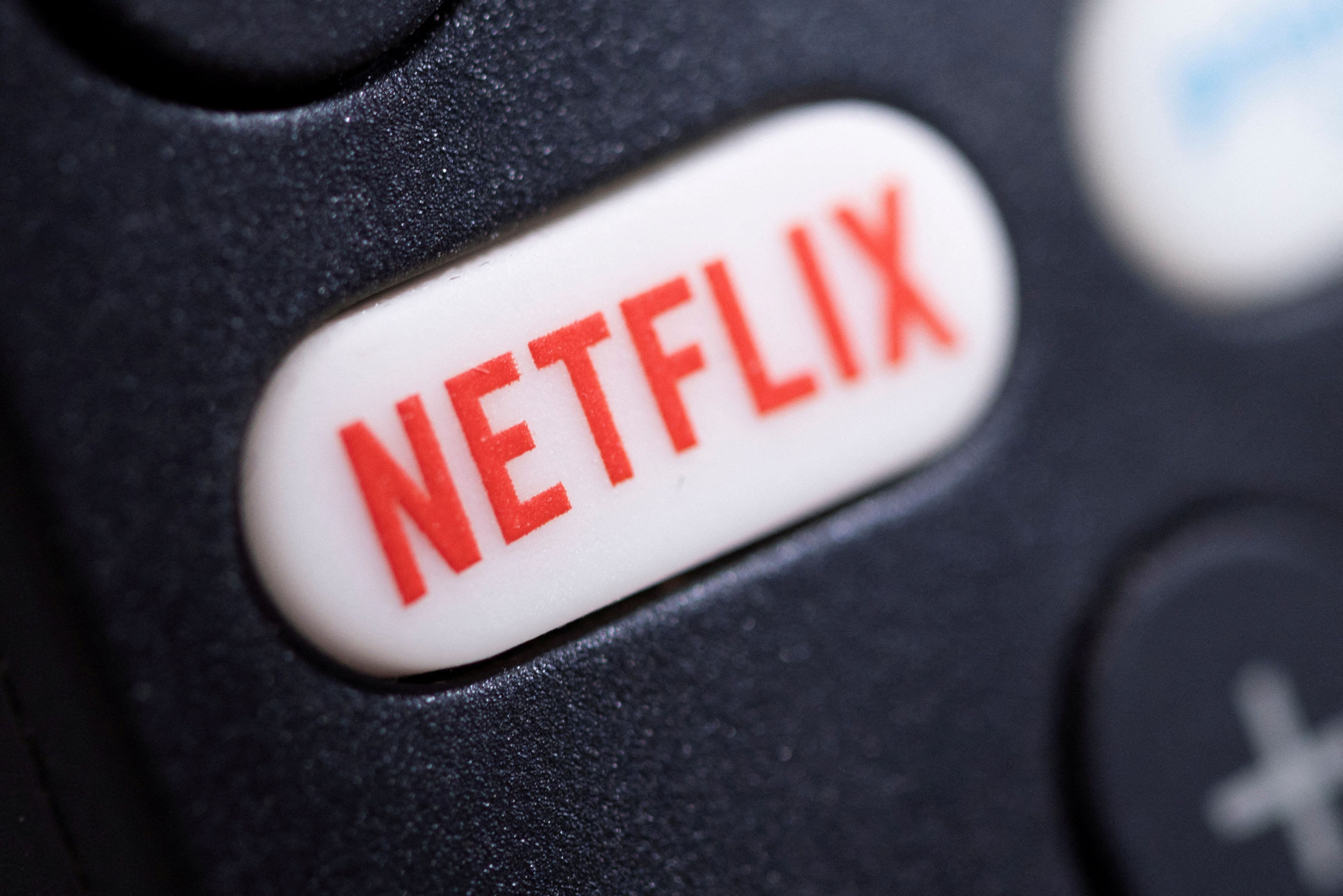 FILE PHOTO: The Netflix logo is seen on a TV remote controller in this illustration photo taken January 20, 2022. REUTERS/Dado Ruvic/Illustration/File Photo GLOBAL BUSINESS WEEK AHEAD