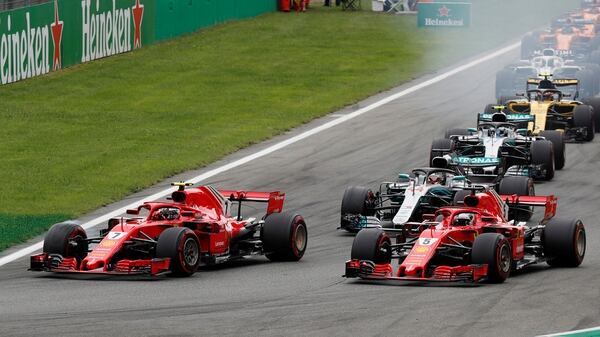 Formula One F1 – Italian Grand Prix – Circuit of Monza, Monza, Italy – September 2, 2018 FerrariÕs Kimi Raikkonen and Sebastian Vettel lead at the start of the race REUTERS/Stefano Rellandini