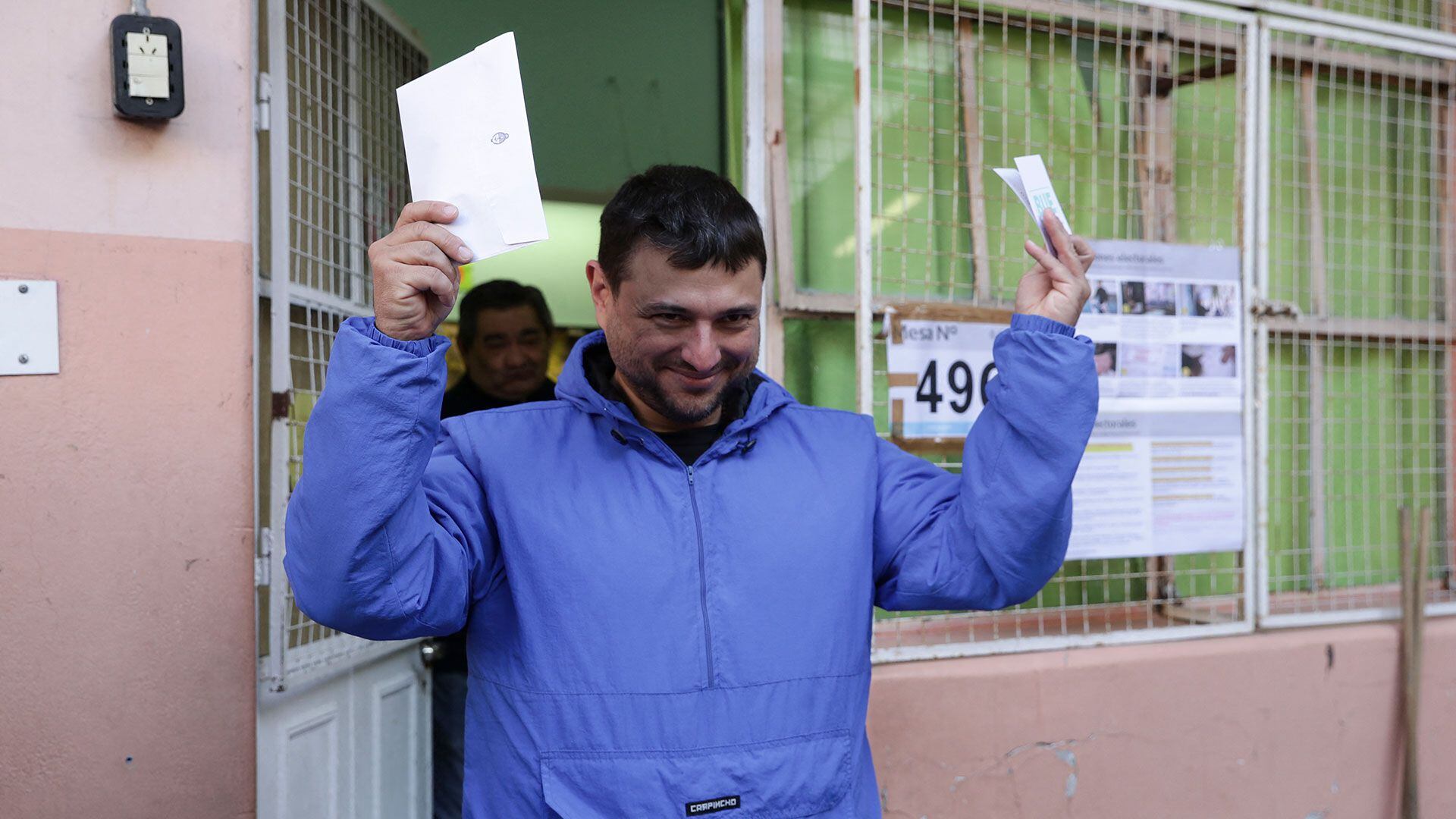 Argentina's presidential pre-candidate for the Union por la Patria party, Juan Grabois (C), votes during primary elections at a polling station in Buenos Aires on August 13, 2023. (Photo by ALEJANDRO PAGNI / AFP)