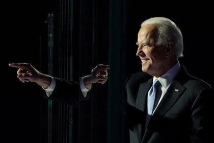 FILE PHOTO: President-elect Joe Biden points a finger at his election rally in Wilmington, Delaware, November 7. REUTERS/Kevin Lamarque/File Photo