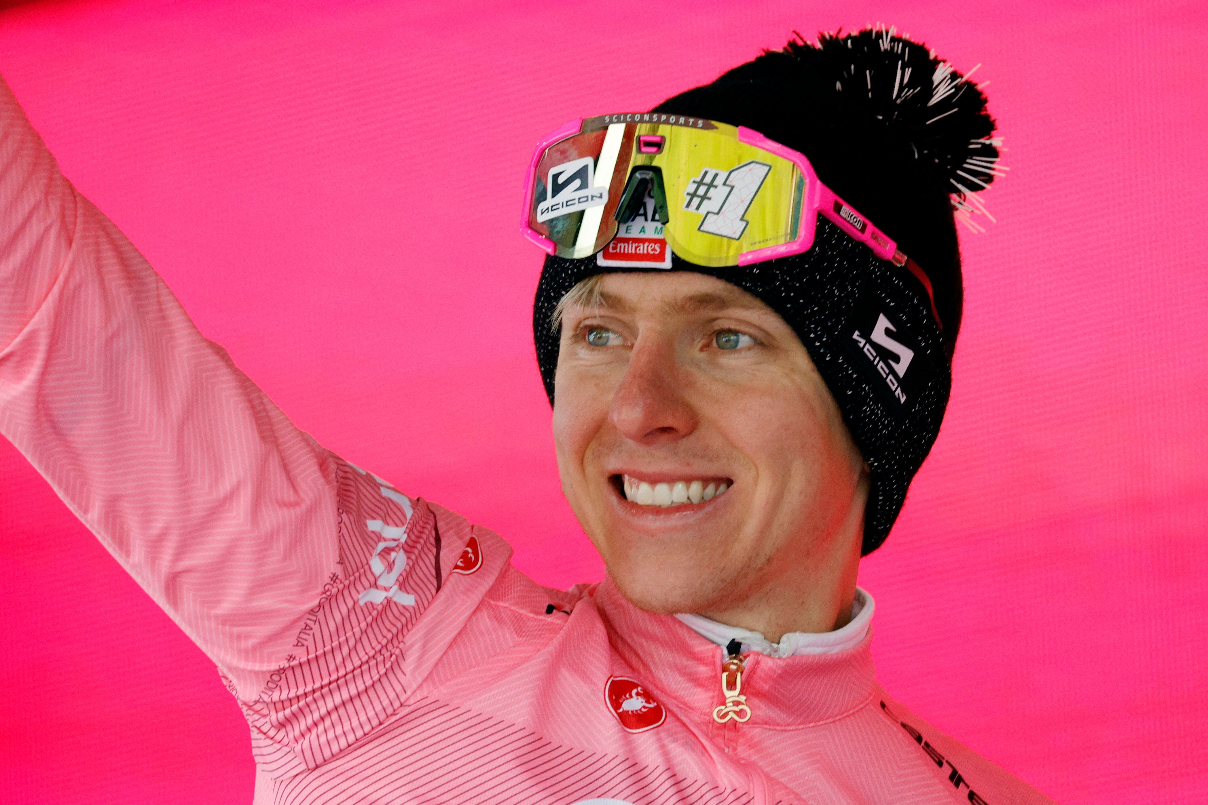 Cycling - Giro d'Italia - Stage 17 - Selva di Val Gardena/Wolkenstein in Groden to Passo del Brocon - Italy - May 22, 2024 UAE Team Emirates' Tadej Pogacar celebrates wearing the maglia rosa jersey on the podium after stage 17 REUTERS/Ciro De Luca