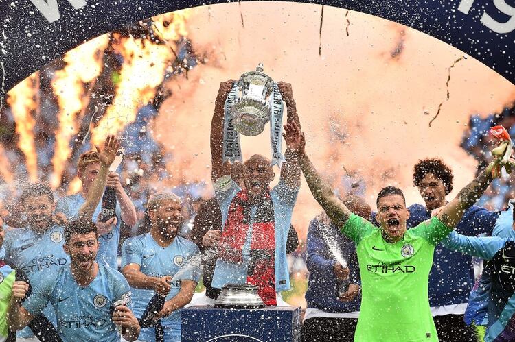 Manchester City celebra el título de campeón (Photo by Glyn KIRK / AFP)