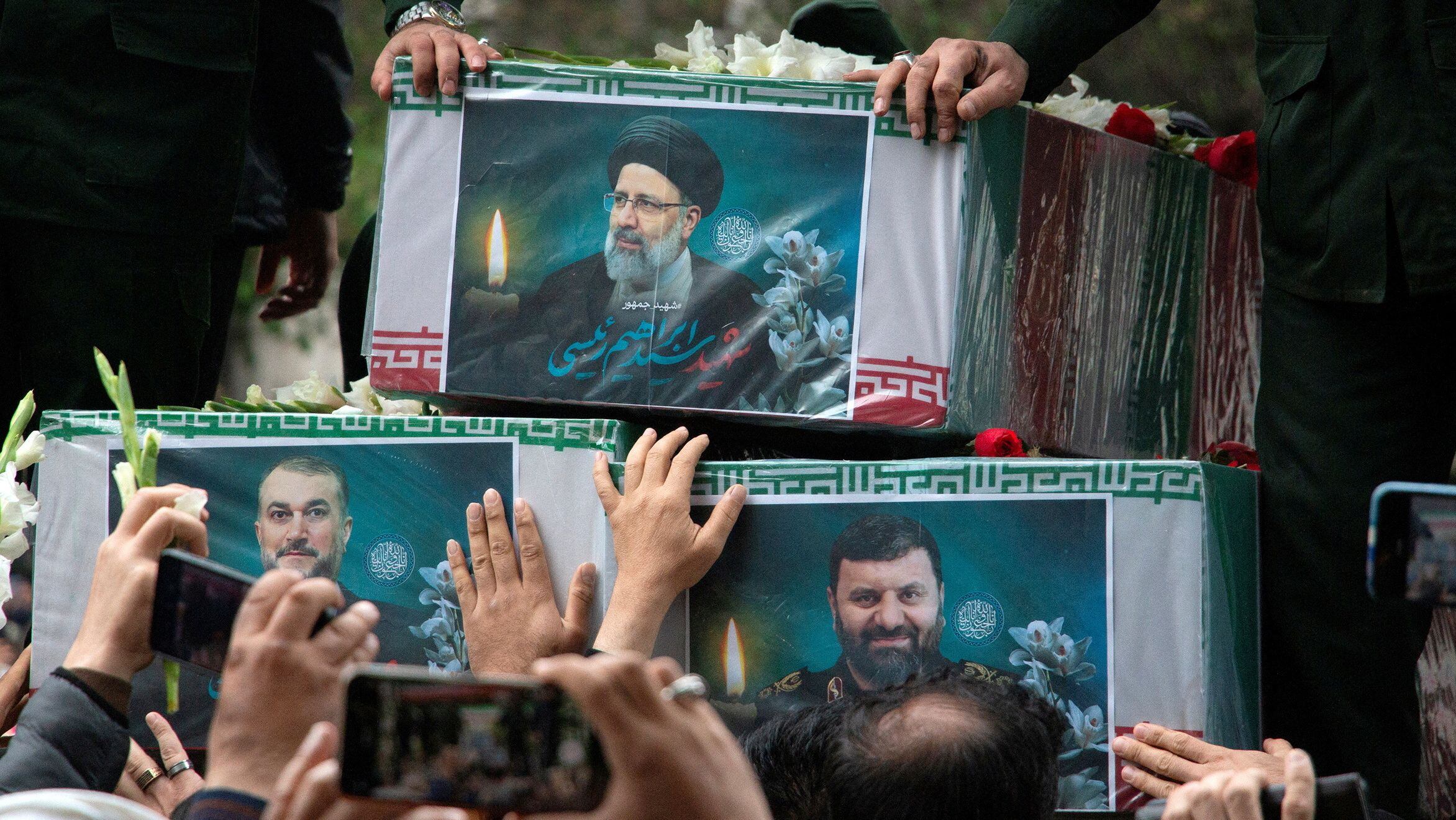 A picture of the late Iranian President Ebrahim Raisi is seen on his coffin during a funeral ceremony held in Tabriz, East Azerbaijan Province, Iran, May 21, 2024. Stringer/WANA (West Asia News Agency) via REUTERS ATTENTION EDITORS - THIS IMAGE HAS BEEN SUPPLIED BY A THIRD PARTY.   ATTENTION EDITORS - THIS PICTURE WAS PROVIDED BY A THIRD PARTY     TPX IMAGES OF THE DAY