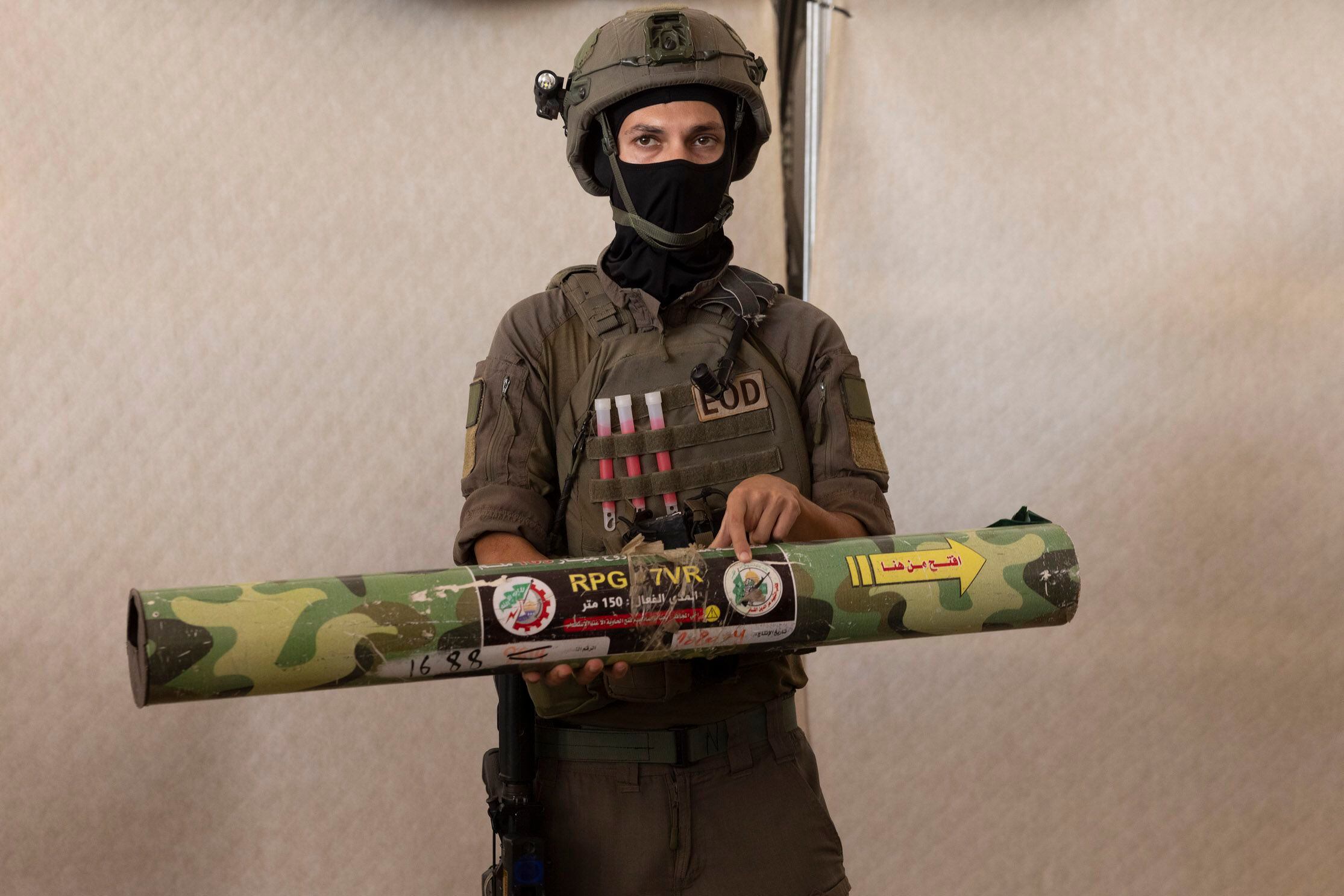 An Israeli officer holds a rocket-propelled grenade during a news conference at a military base in southern Israel on Oct. 20, 2023. MUST CREDIT: Heidi Levine for The Washington Post.