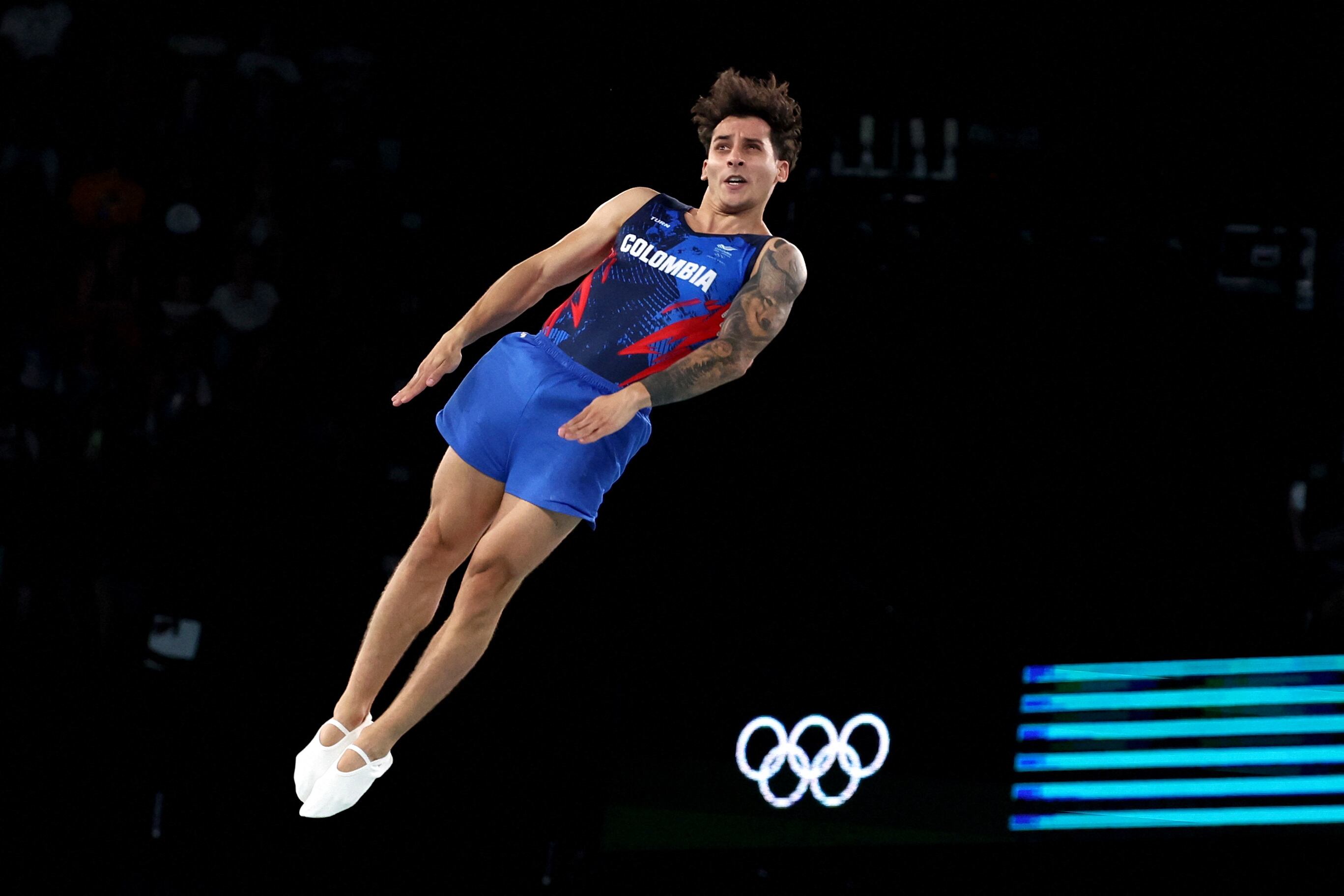 Ángel Hernández en acción durante la competencia de gimnasia en trampolín - crédito Mike Blake / REUTERS