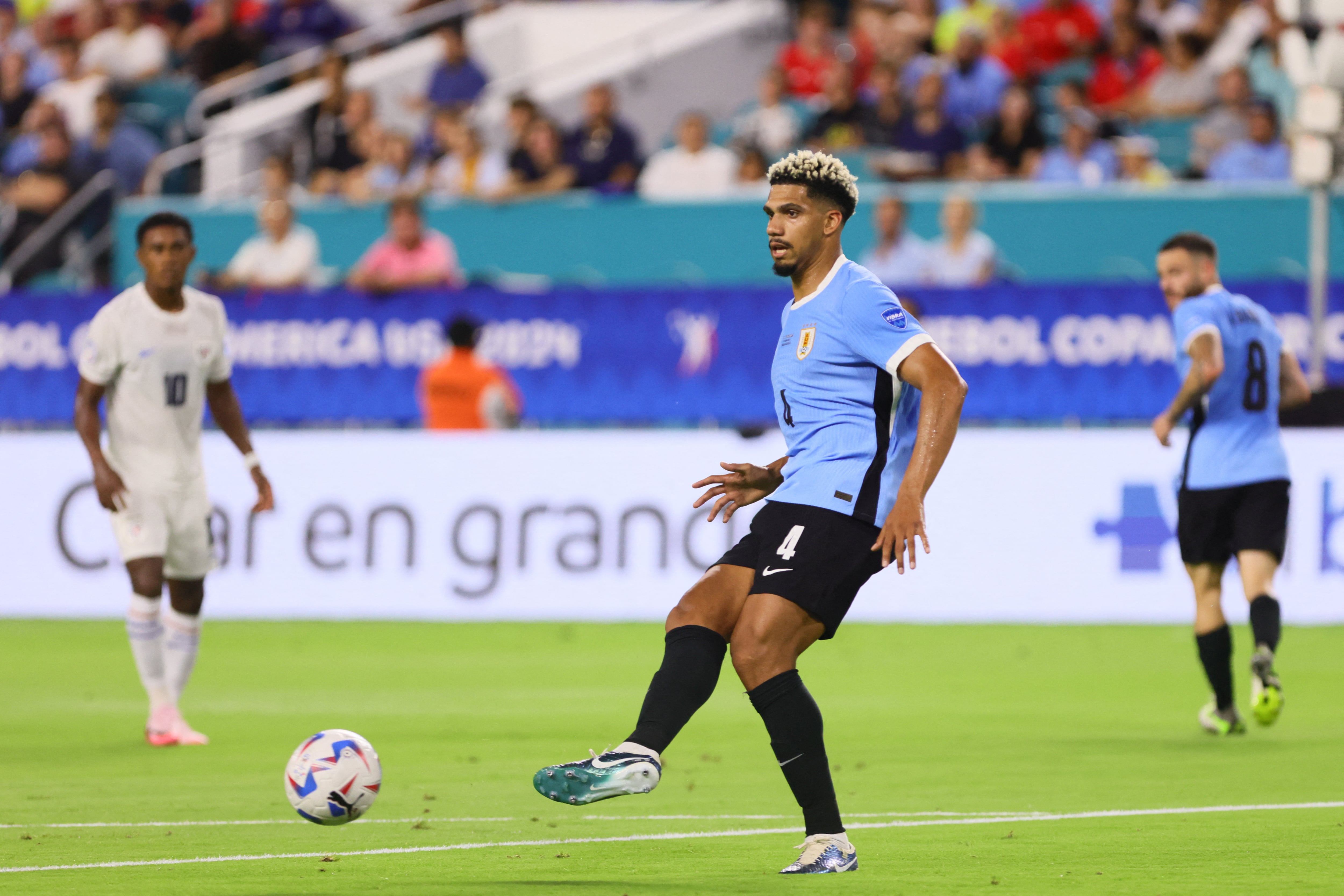 Jun 23, 2024; Miami, FL, USA; Uruguay defender Ronald Araujo (4) passes the ball against Panama in the first half during the group stage of Copa America at Hard Rock Stadium. Mandatory Credit: Sam Navarro-USA TODAY Sports