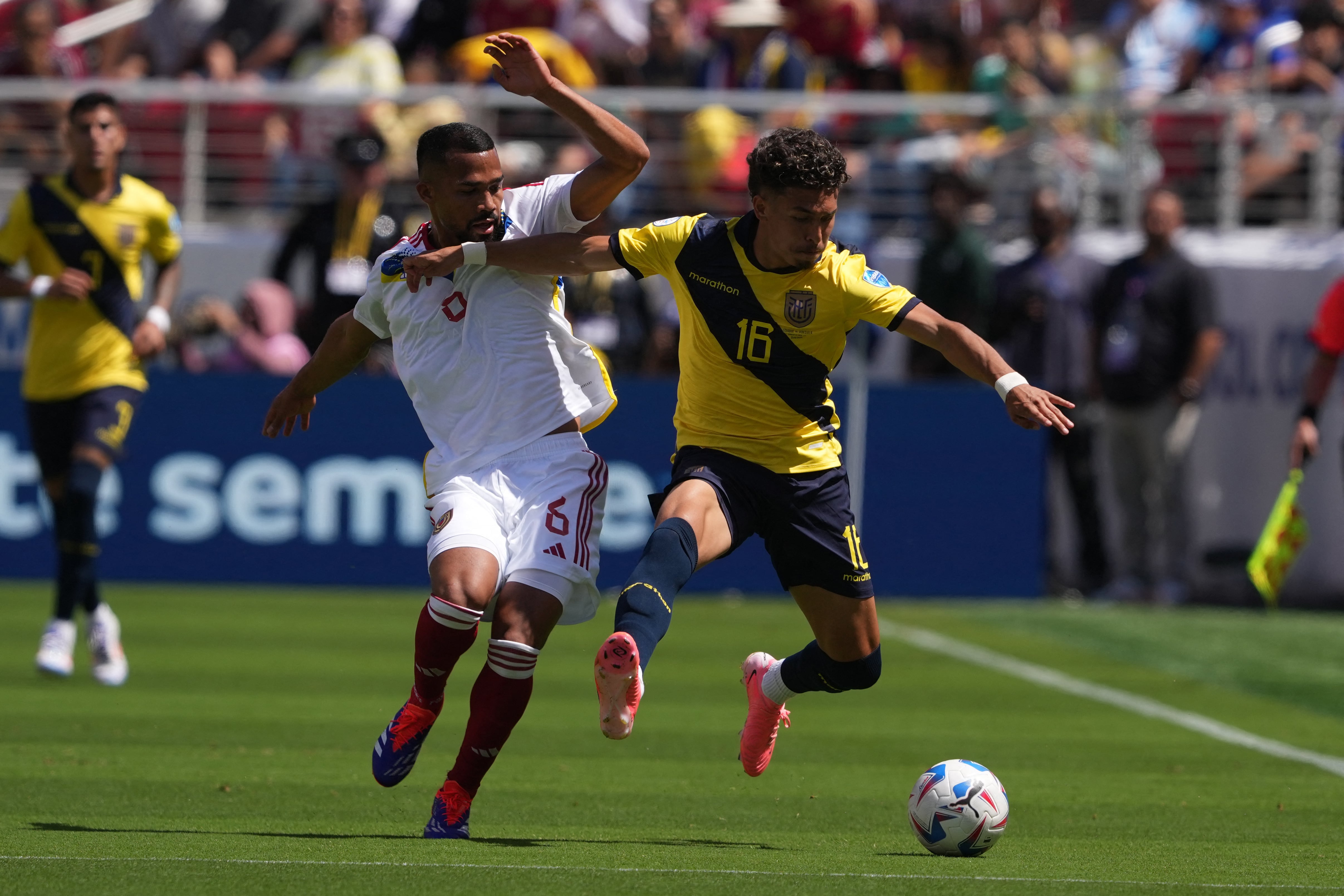 Jun 22, 2024; Santa Clara, CA, USA; Ecuador midfielder Jeremy Sarmiento (16) dribbles against Venezuela midfielder Yangel Herrera (6) during the first half at Levi's Stadium. Mandatory Credit: Darren Yamashita-USA TODAY Sports