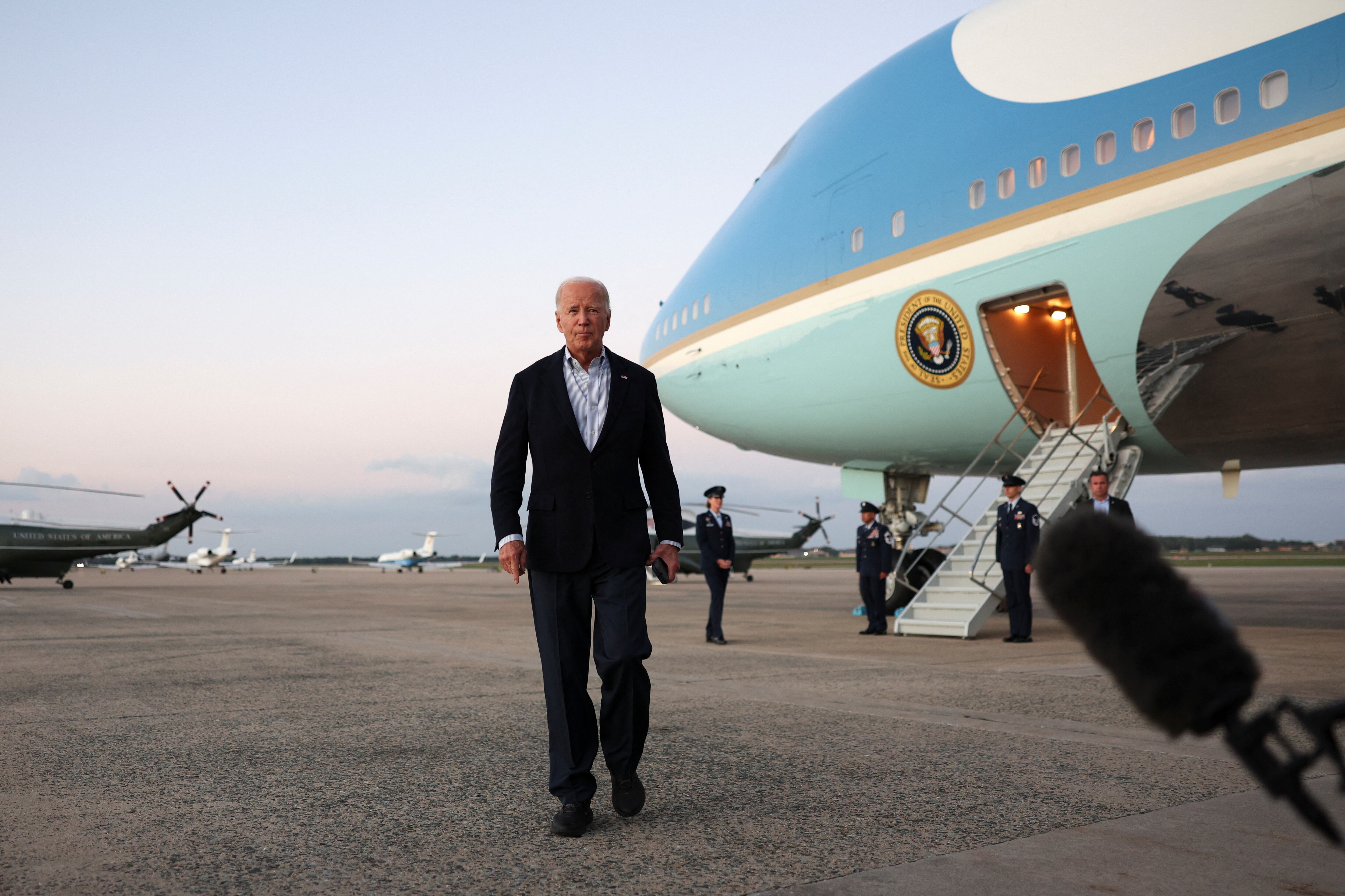 U.S. President Joe Biden walks on the tarmac after visiting storm-damaged areas in the wake of Hurricane Helene, at Joint Base Andrews in Maryland, U.S., October 3, 2024. REUTERS/Tom Brenner