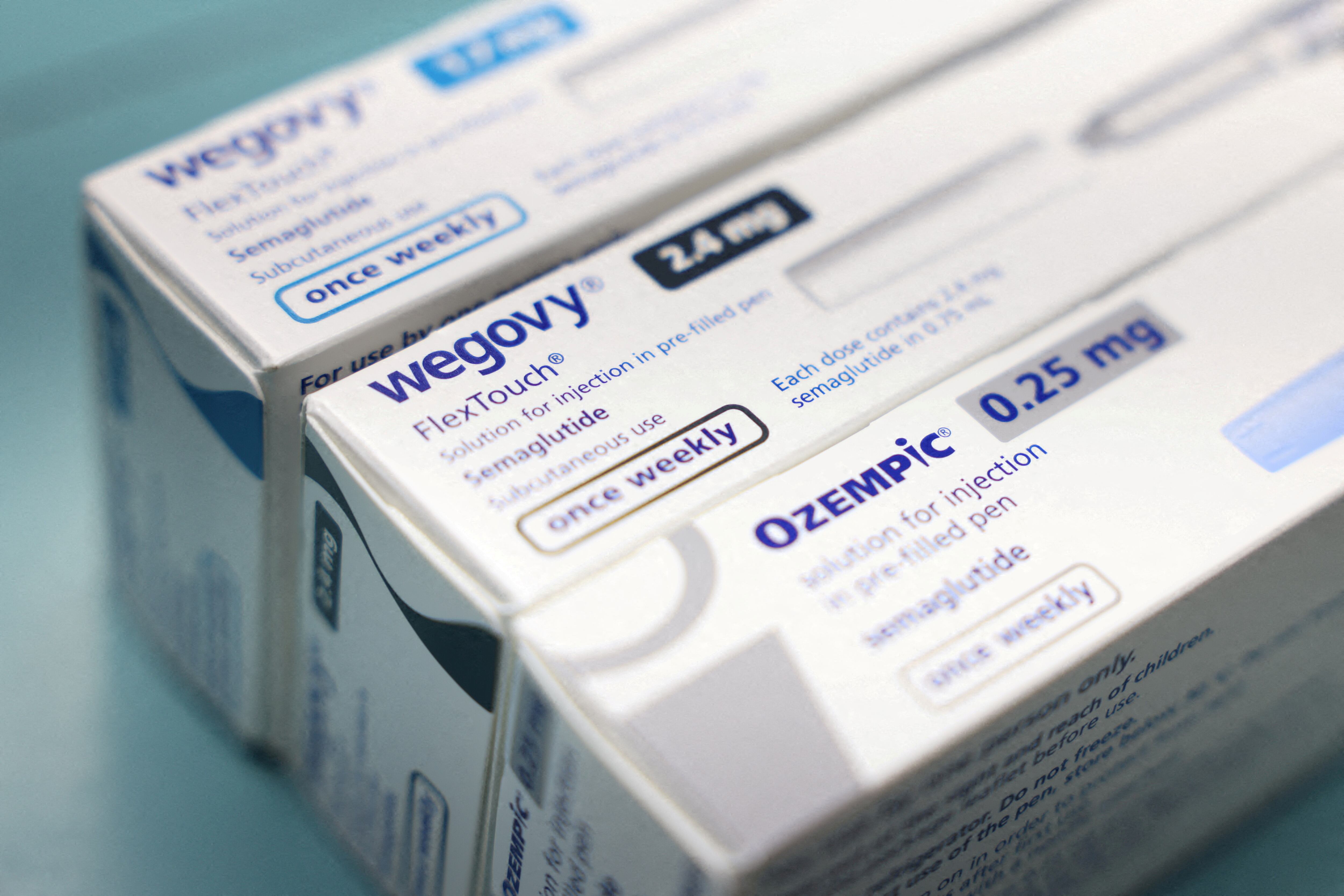 FILE PHOTO: FILE PHOTO: Boxes of Ozempic and Wegovy made by Novo Nordisk are seen at a pharmacy in London, Britain March 8, 2024. REUTERS/Hollie Adams/File Photo/File Photo