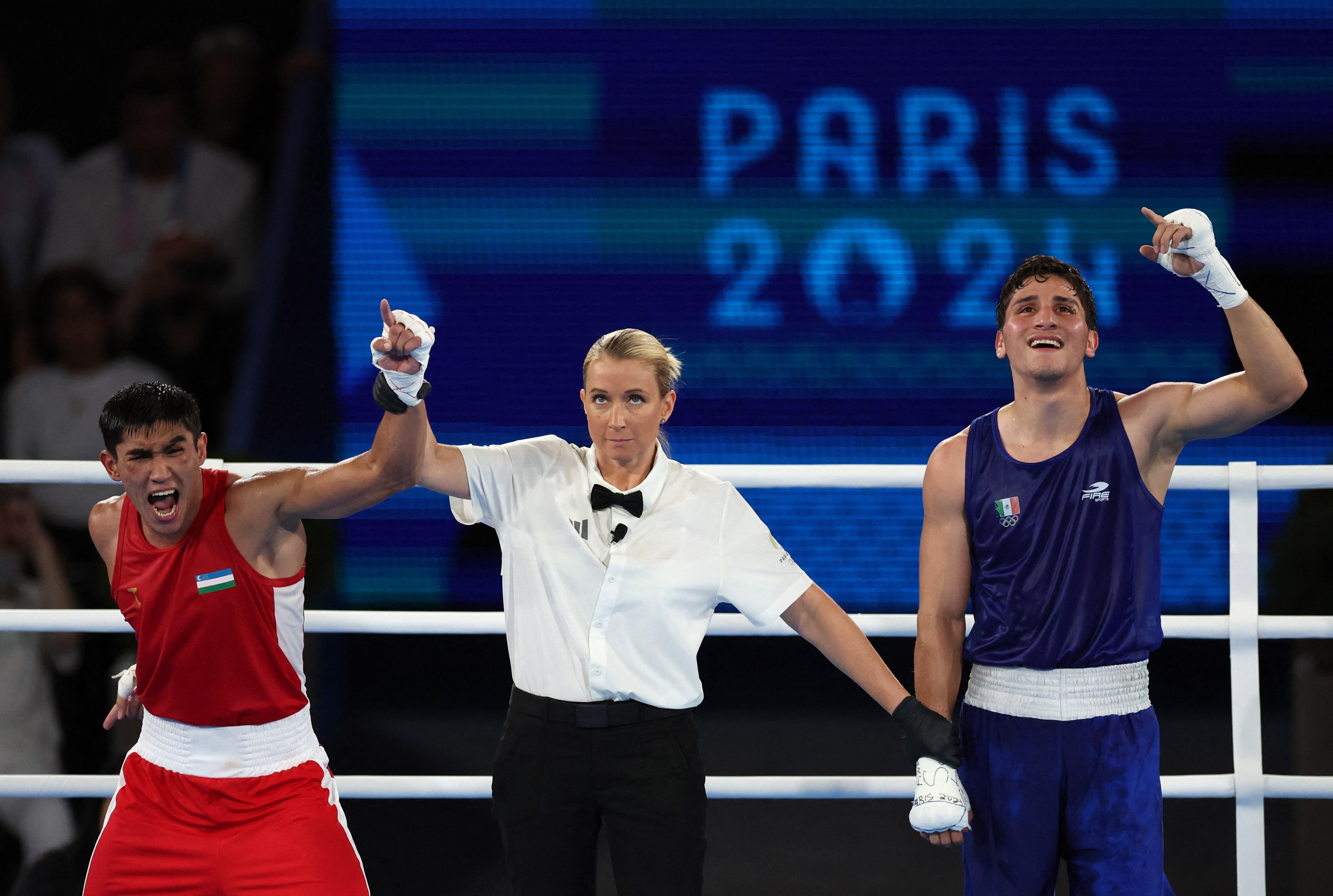 Paris 2024 Olympics - Boxing - Men's 71kg - Final - Roland-Garros Stadium, Paris, France - August 09, 2024. Asadkhuja Muydinkhujaev of Uzbekistan celebrates after winning against Marco Alonso Verde Alvarez of Mexico. REUTERS/Pilar Olivares