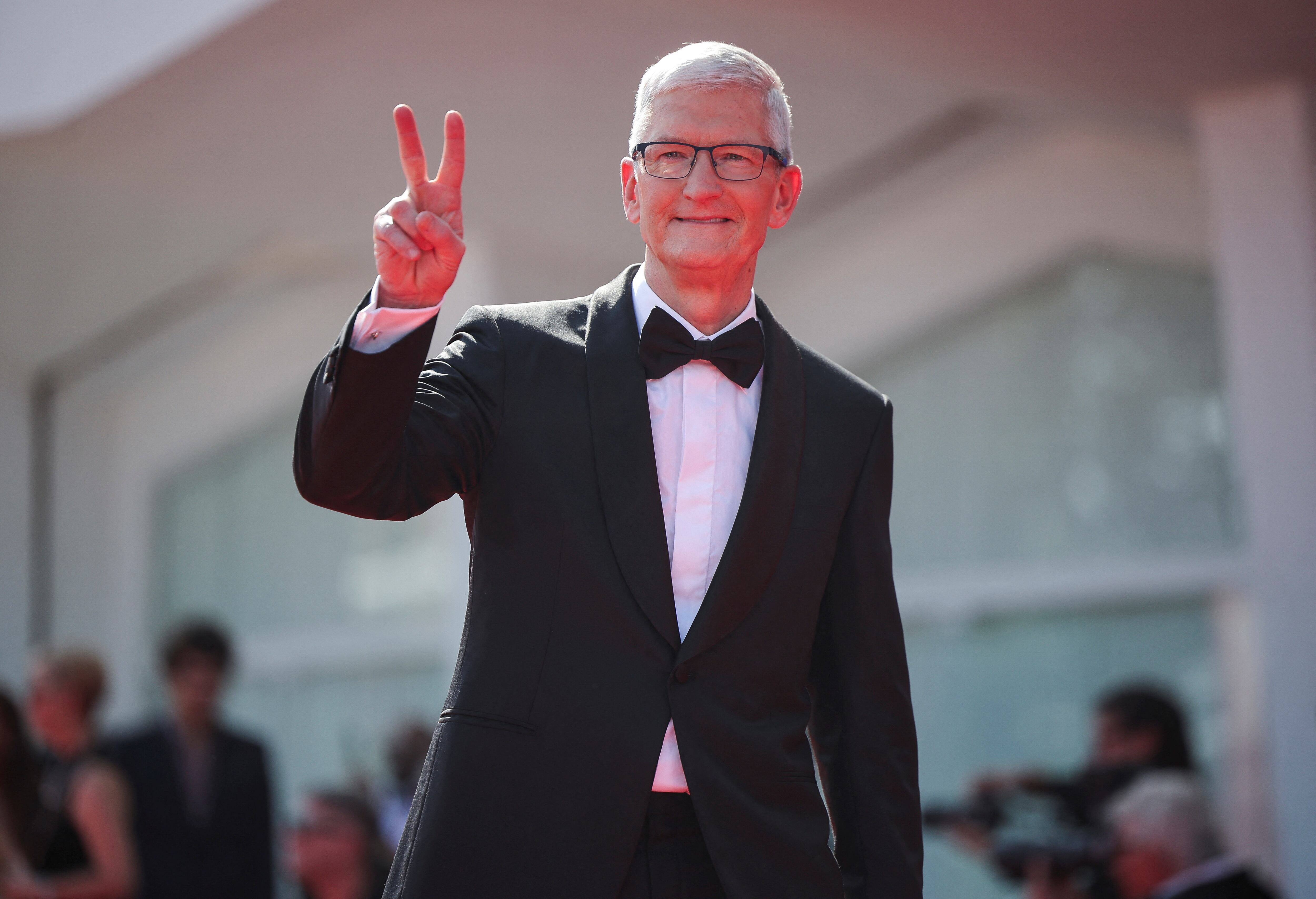 Apple CEO Tim Cook gestures as he poses on the red carpet during arrivals for the screening of the mini-series "Disclaimer", out of competition, at the 81st Venice Film Festival, in Venice, Italy August 29, 2024. REUTERS/Louisa Gouliamaki