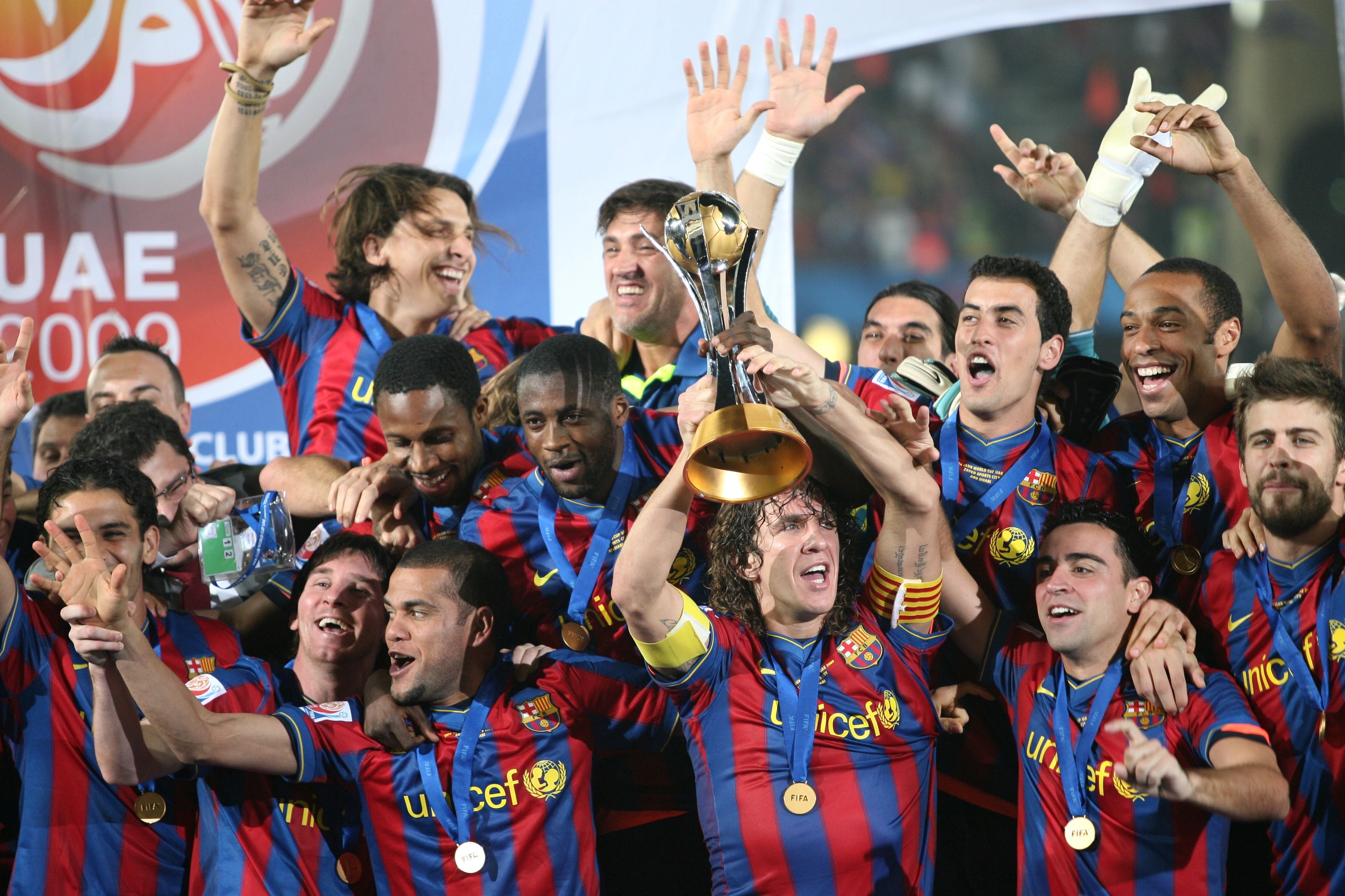 Mandatory Credit: Photo by Mc Films/Shutterstock (1065049c)
Carles Puyol (C) holds the trophy as he celebrates with team mates
Barcelona v Estudiantes De La Plata, Final of the FIFA Club World Cup Football Match, Abu Dhabi, United Arab Emirates - 19 Dec 2009