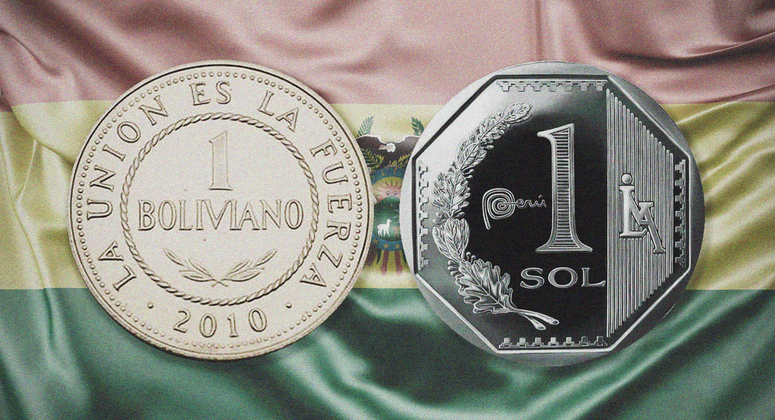 Una moneda boliviana y un sol peruano