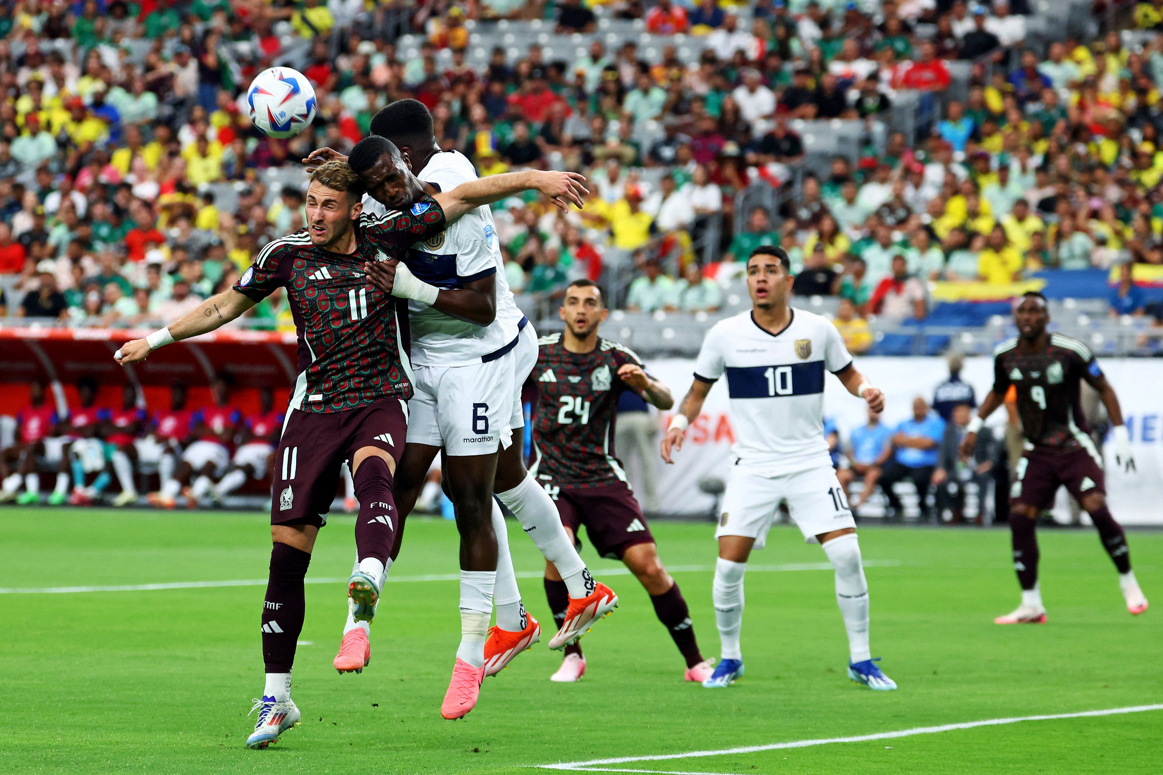 Jun 30, 2024; Glendale, AZ, USA; Mexico forward Santiago Giménez (11) and Ecuador defender William Pacho (6) go for a header during the first half in the Copa America soccer tournament at State Farm Stadium. Mandatory Credit: Mark J. Rebilas-USA TODAY Sports